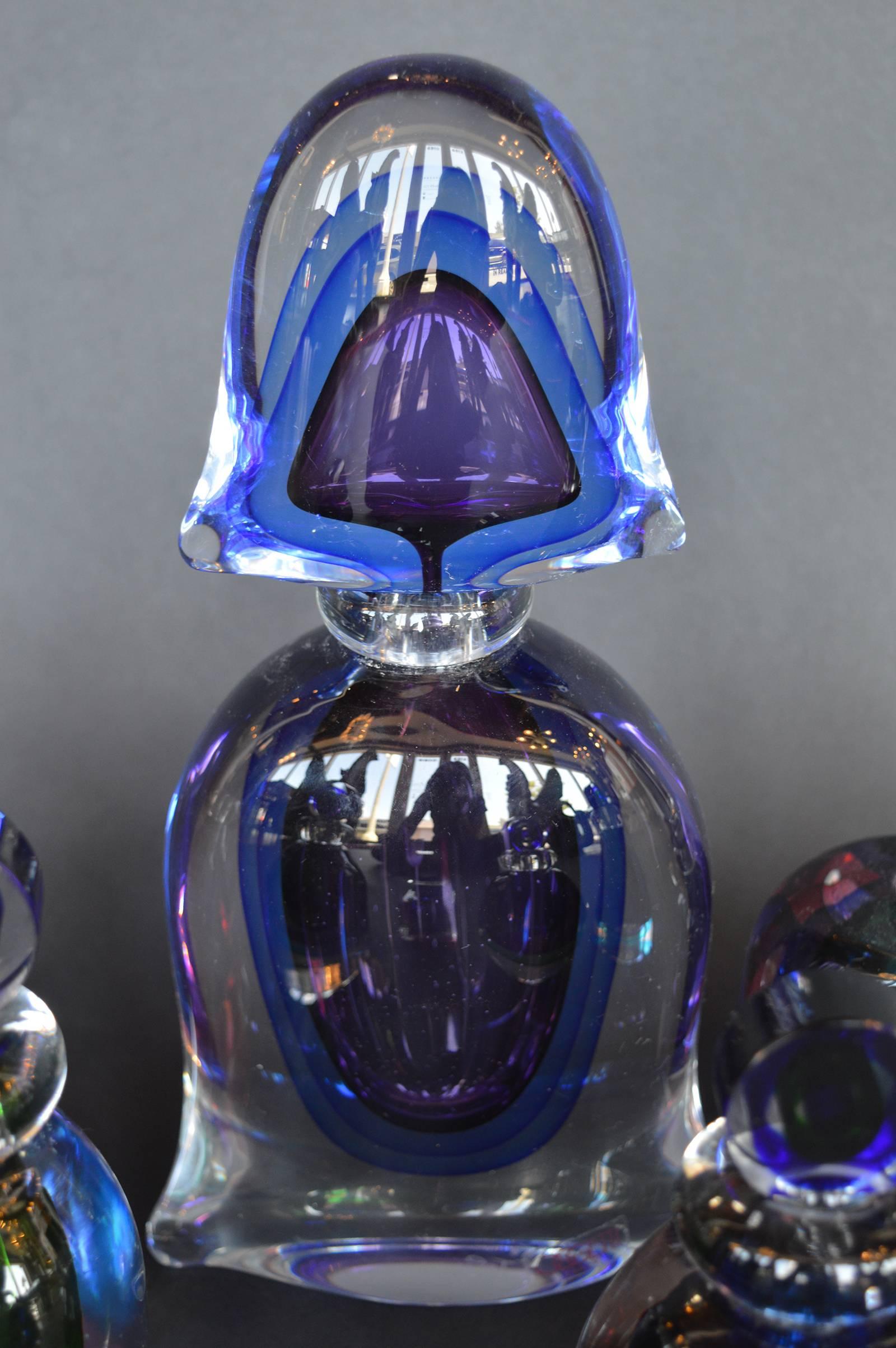 Collection of Seven Murano glass perfume bottles. Multiple sizes and colors, all have their sticker.