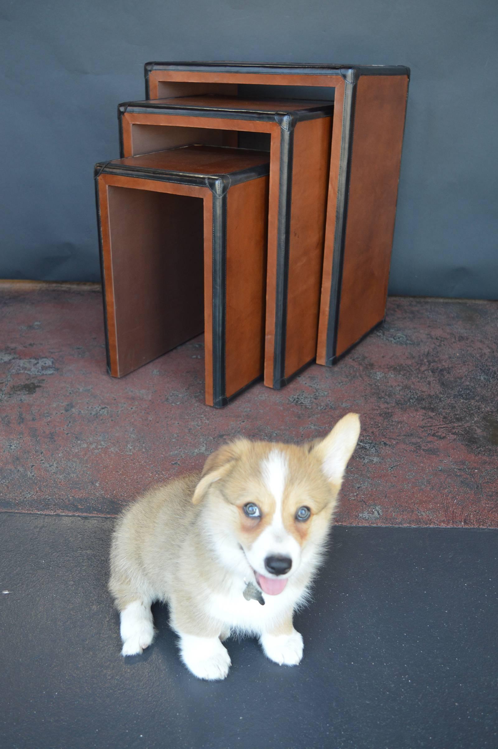 Brown and black leather nesting tables.