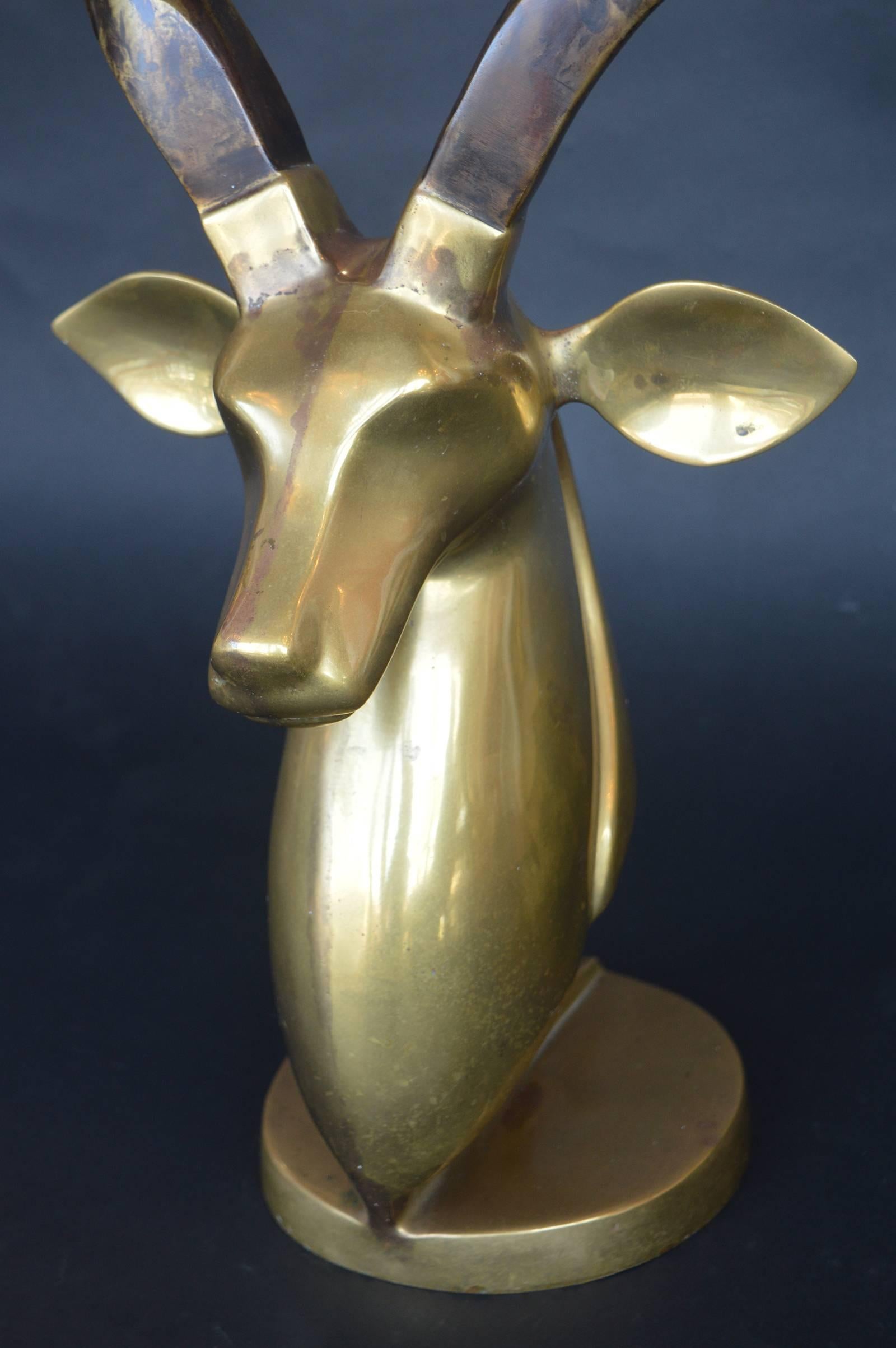 Brass antelope bust.