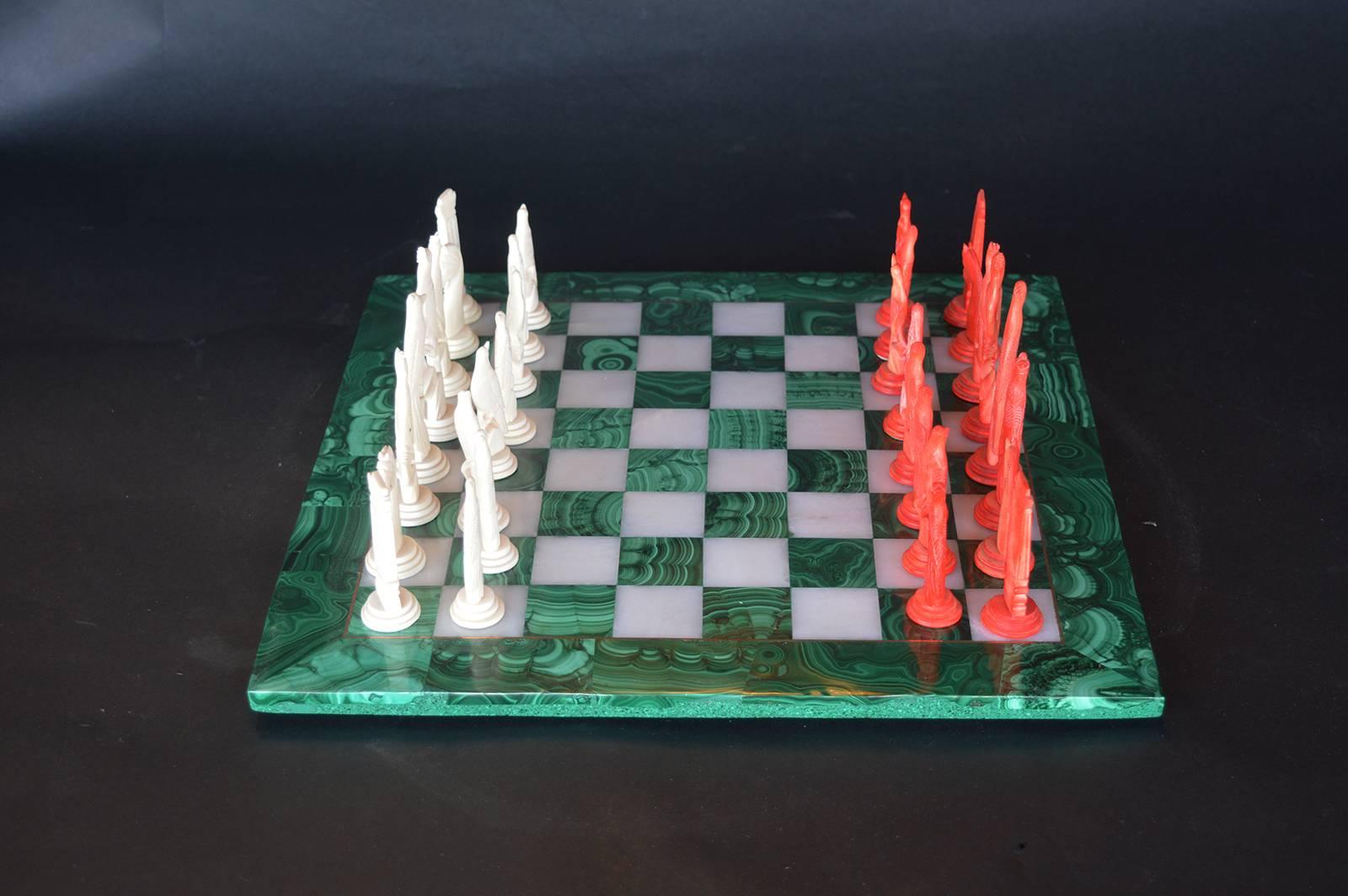 Malachite chess set with bone player pieces.