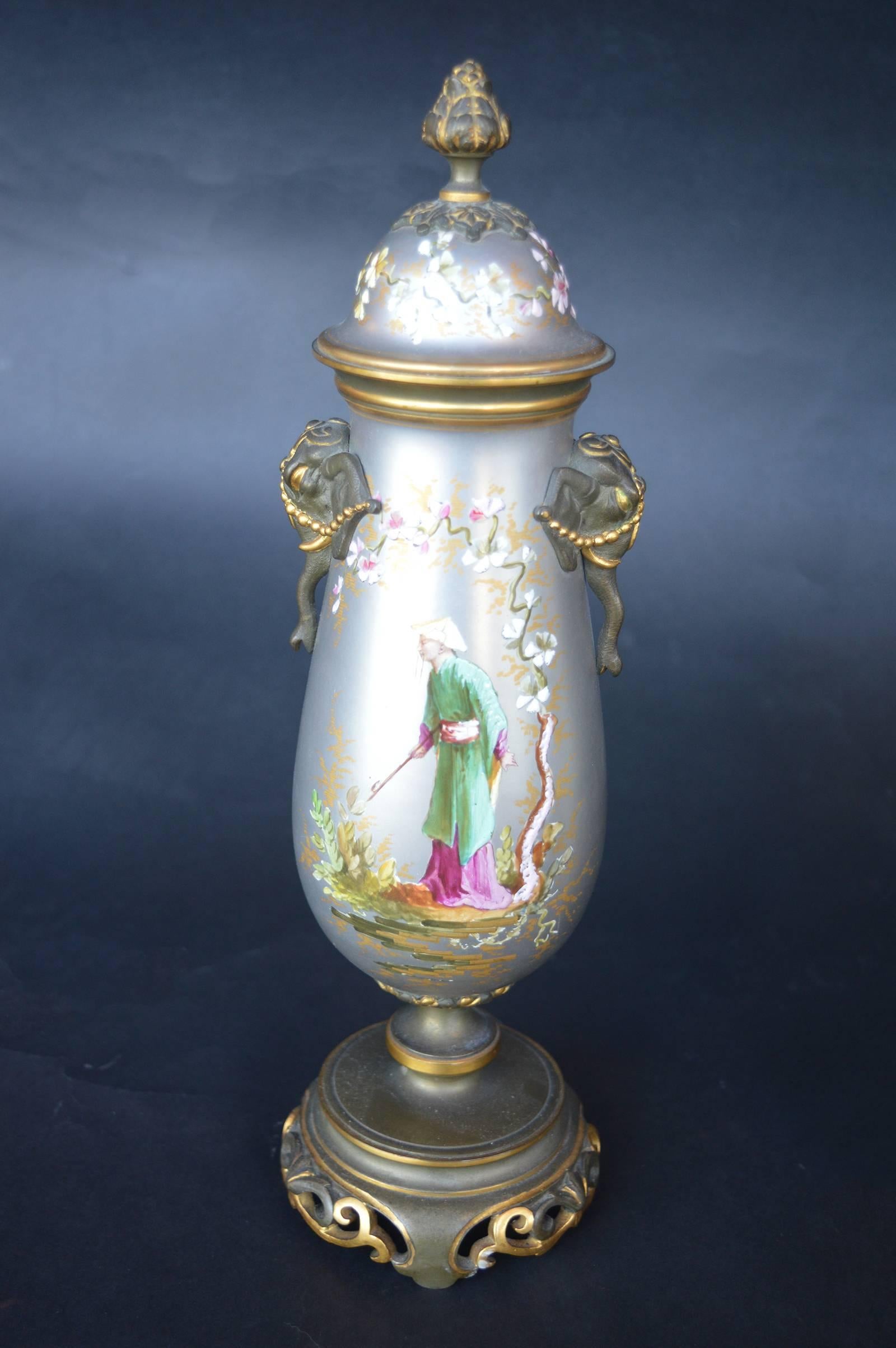 Small French, beautifully hand-painted clock set. Pair of urns measure to be: 12.5