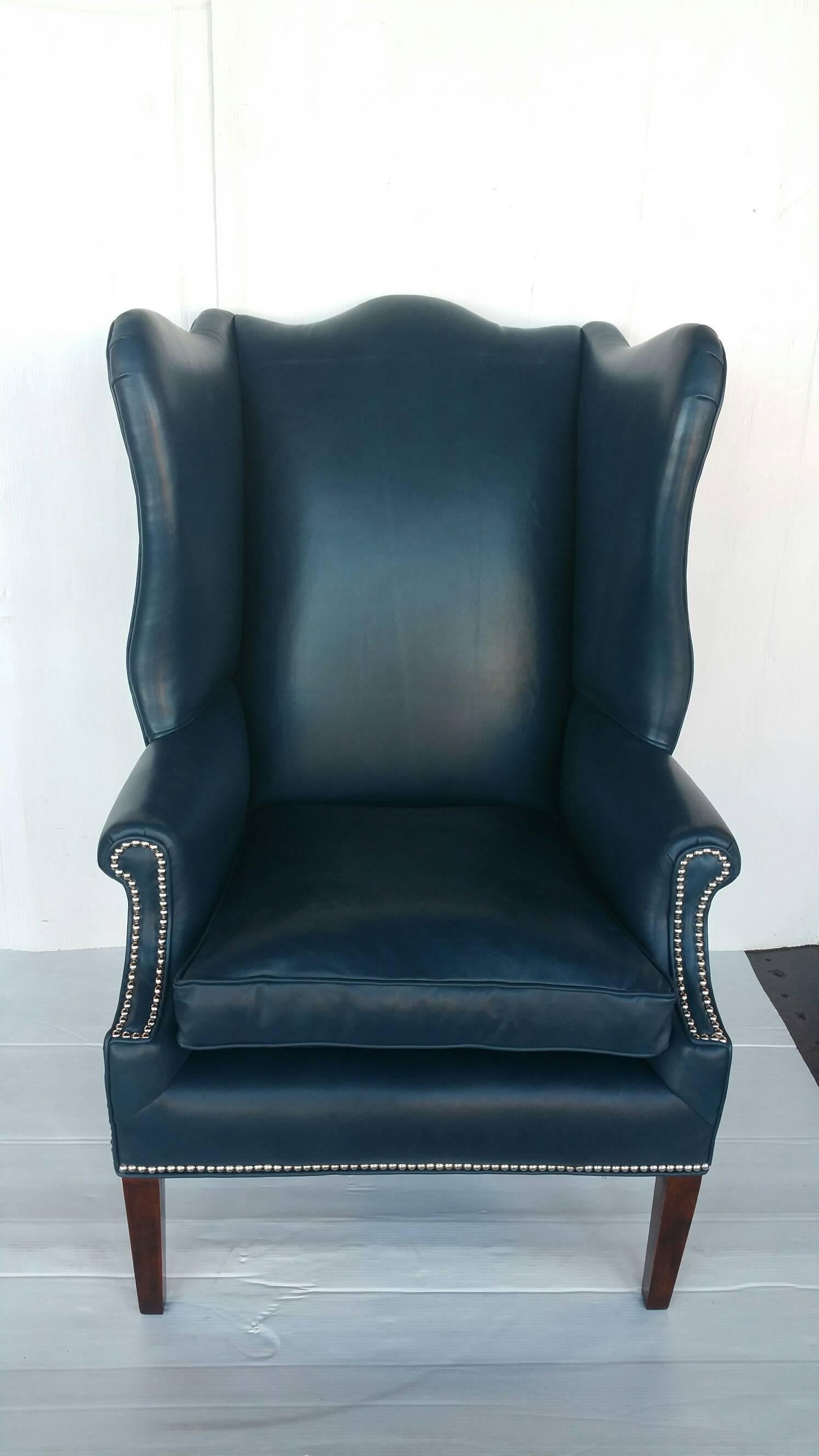 Pair of wingback chairs
newly re-upholstered in beautiful suptle Italian blue leather.