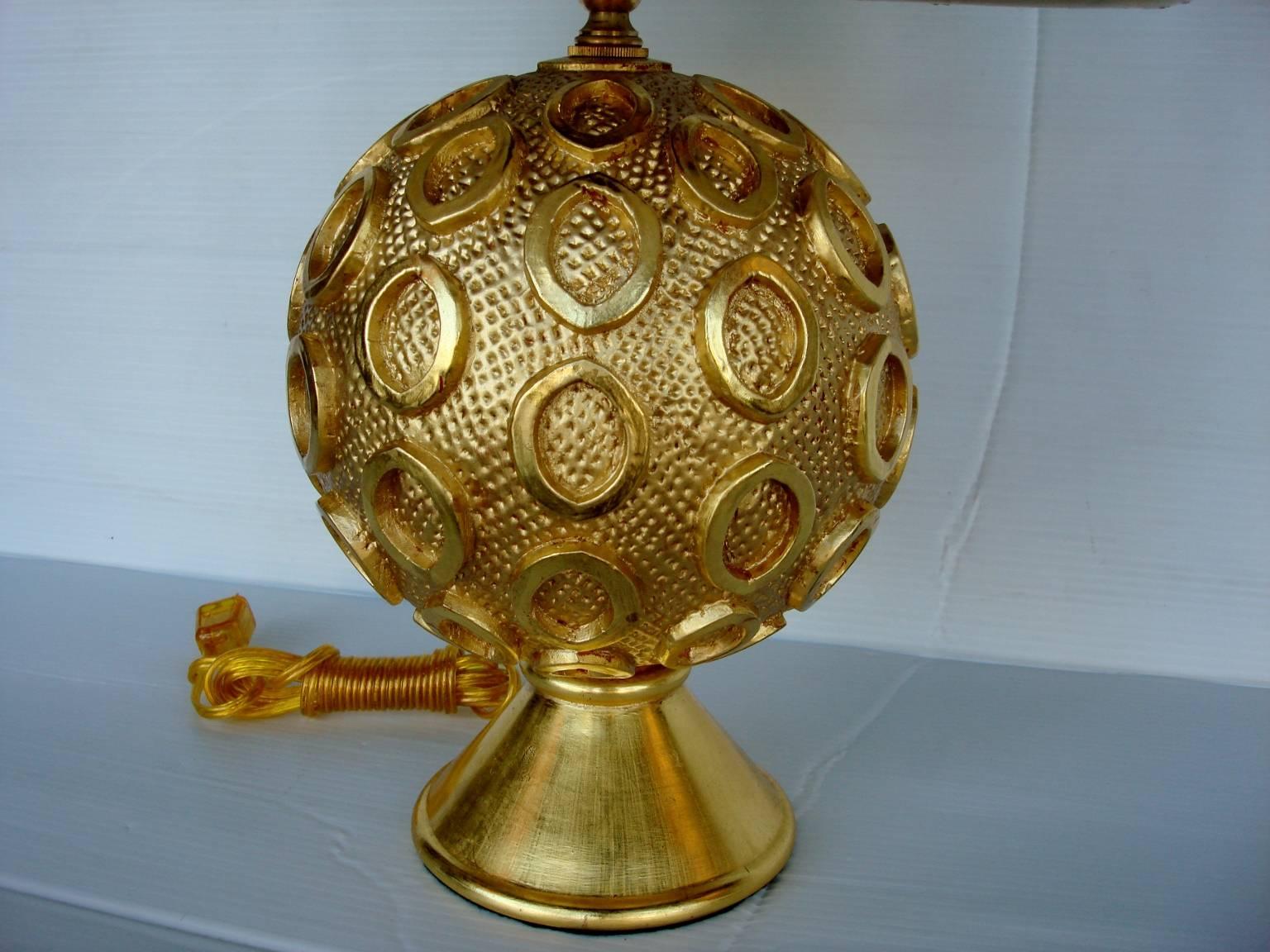 Pair of gilded table lamps by Bryan Cox. Height to the top of the socket is 15.5 inches. Height to the top of the finial is 24 inches. Diameter of the body is 8 inches. Size of the shade is 14.25 diameter by 11 inches half.