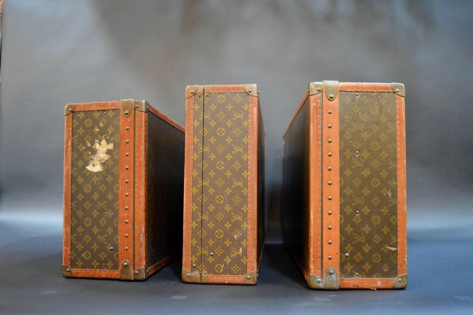 Set of three vintage Louis Vuitton suitcases. Original hardware and lining to the pieces. Stamped with original owner's initials.

Measure: Large size 30