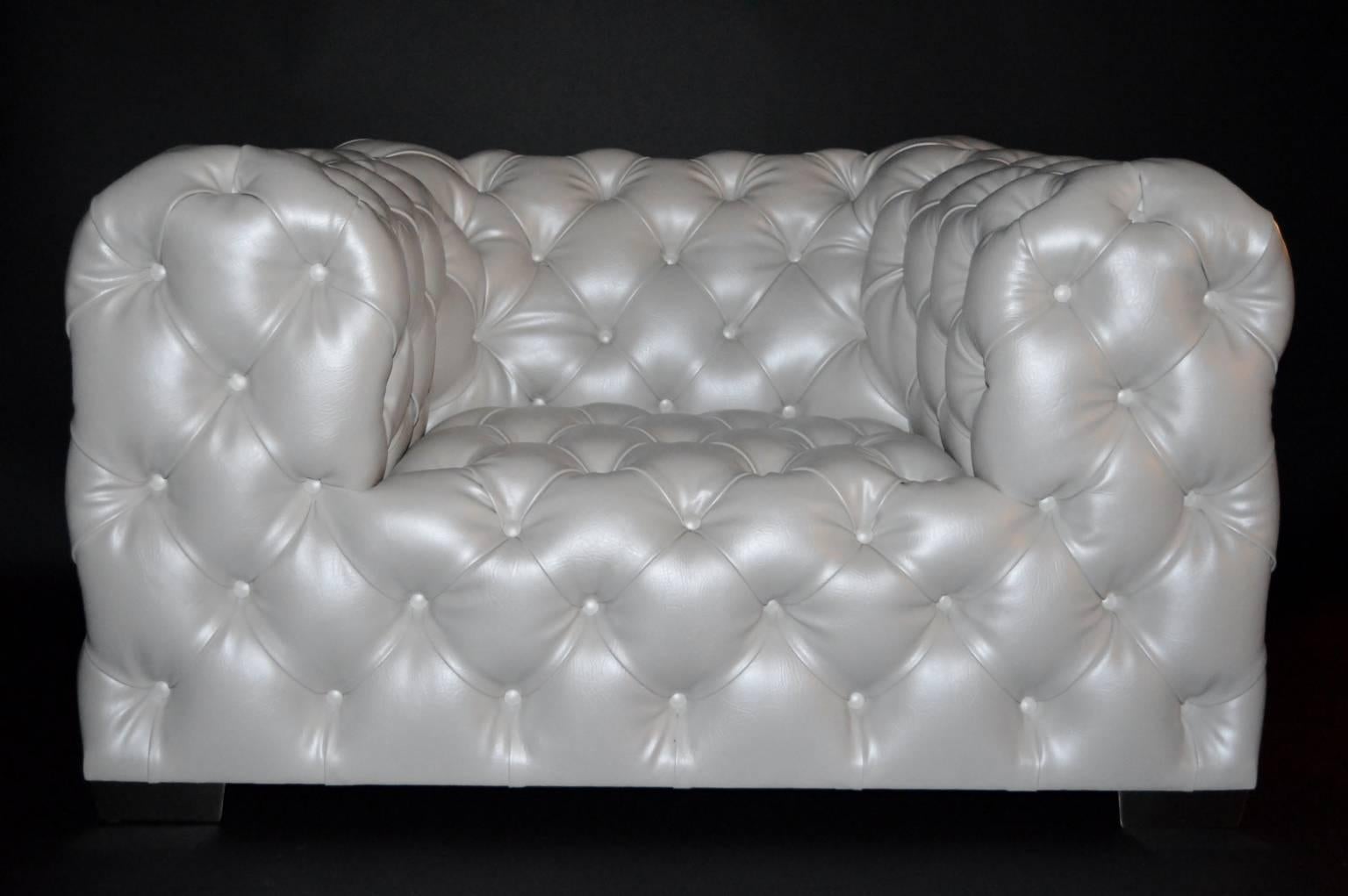 Pair of oversized tufted leather armchairs in a pearl white.