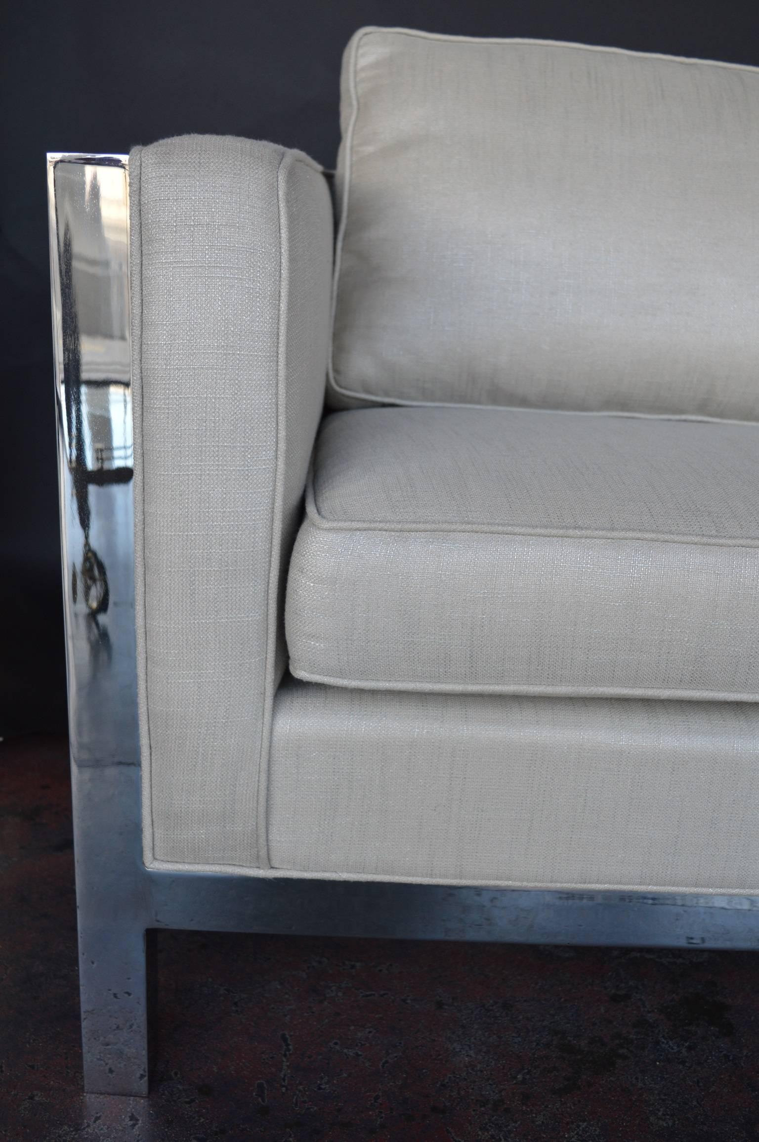 Milo Baughman loveseat. Framed with polished steel and newly reupholstered (Scotch Guard protected).