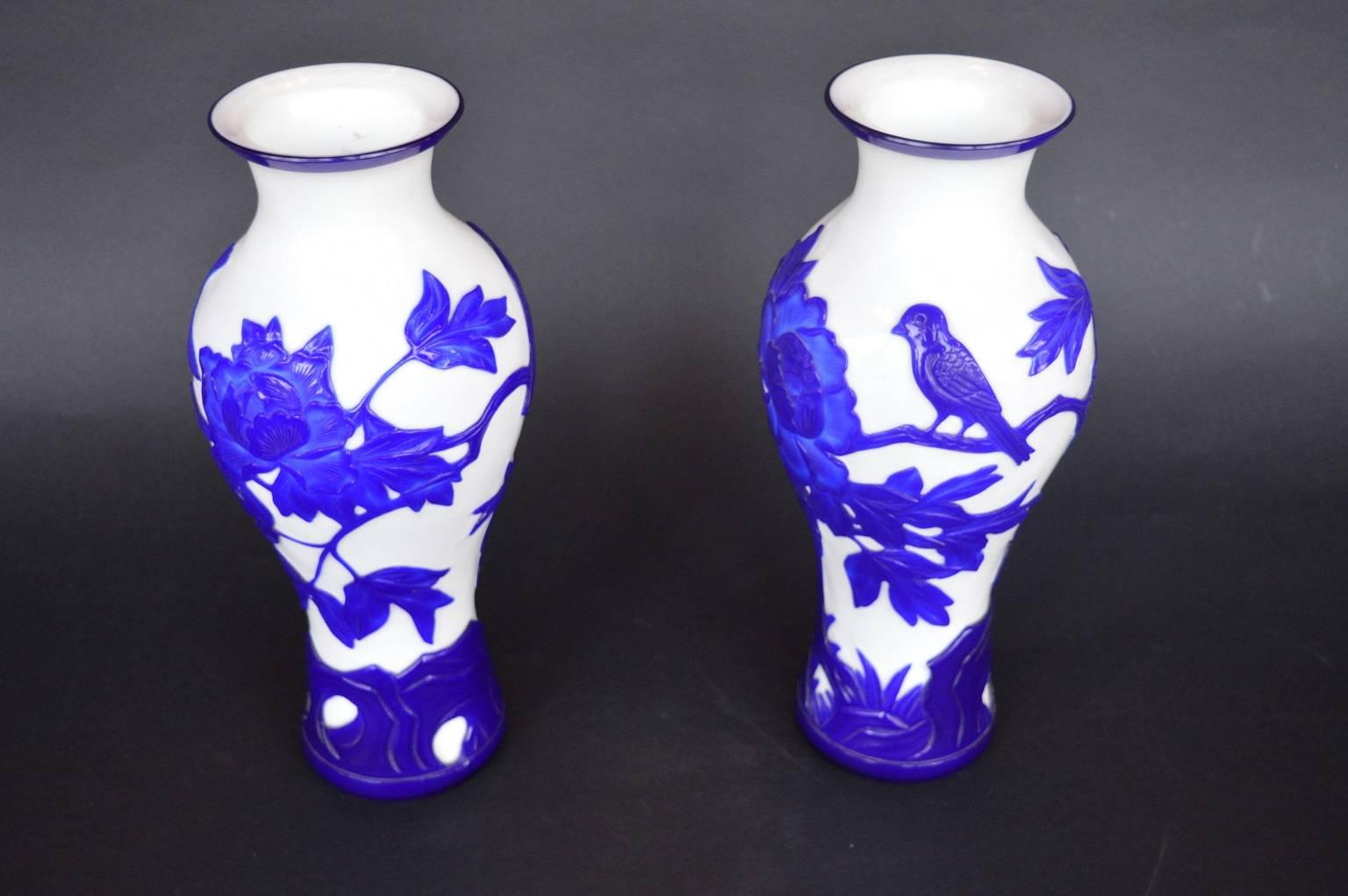 Pair of white and cobalt blue, hand-cut glass Peking vases.