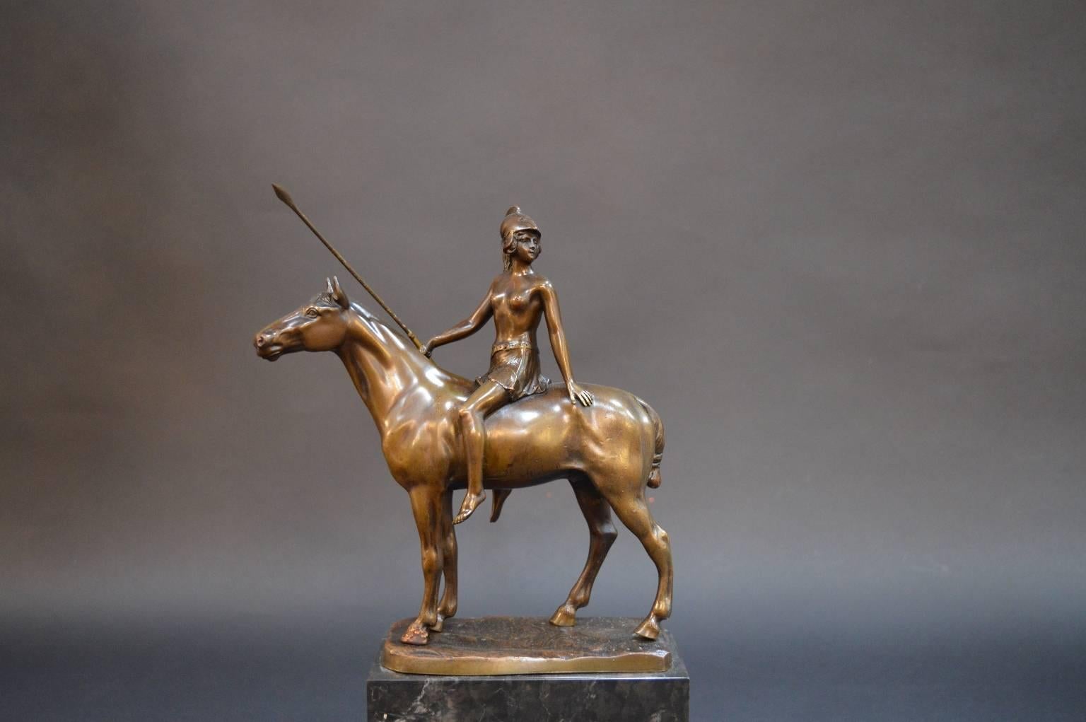 A bronze Roman female warrior on a marble base. Signed by F. Thiermann.