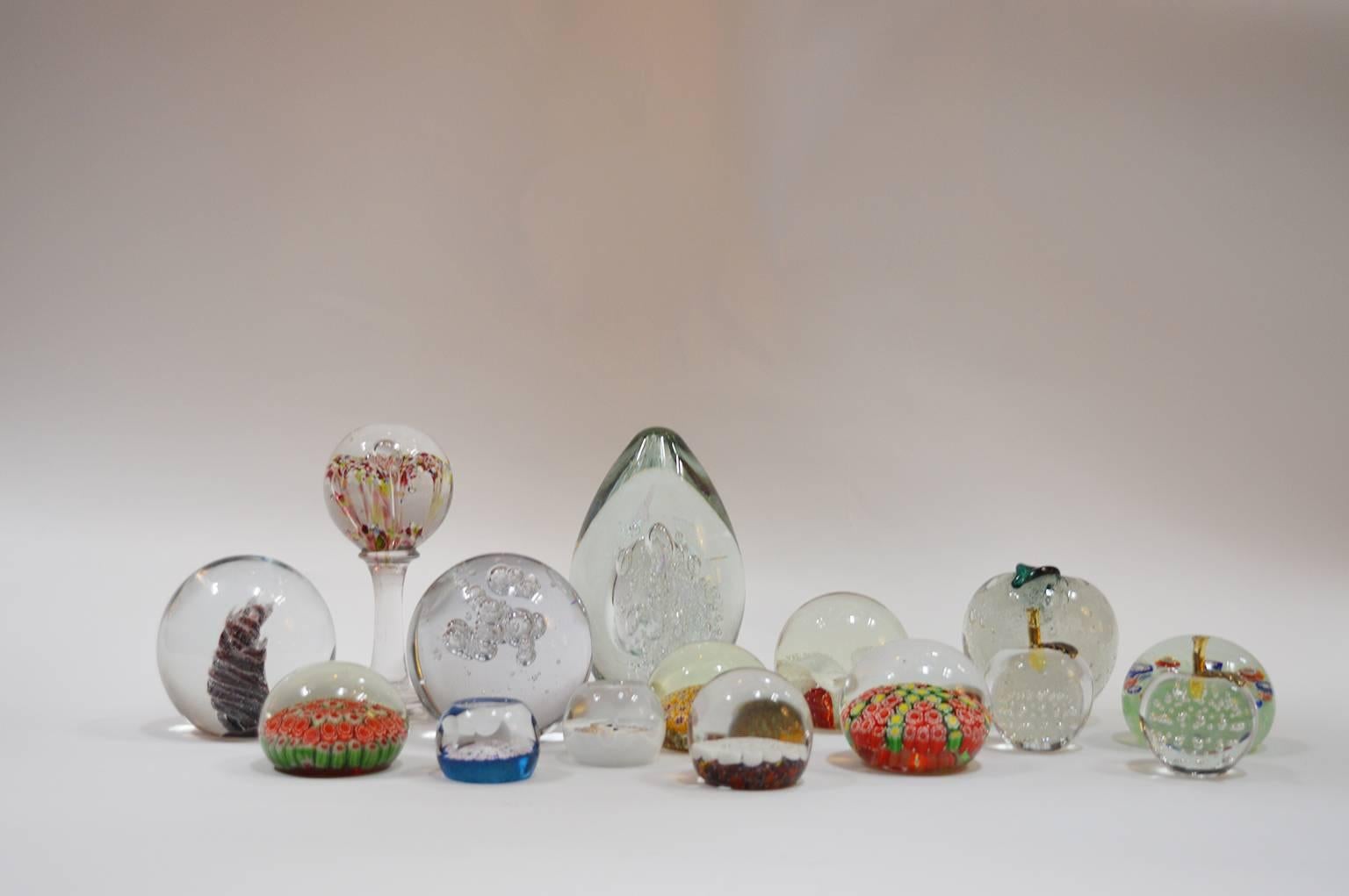 Collection of assorted art glass paper weights.