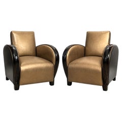 Paire de fauteuils club Art déco français en or et cuir noir
