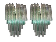 Conjunto de cuatro apliques de pared italianos de cristal de Murano «Venini» de los años 60, con prisma de tres capas de cristal.