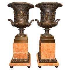 Pair of 19th Century French Bronze Urns on Marble Pedestals.