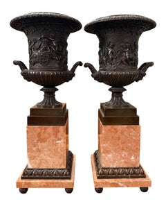 Pair of 19th Century French Bronze Urns on Marble Pedestals.