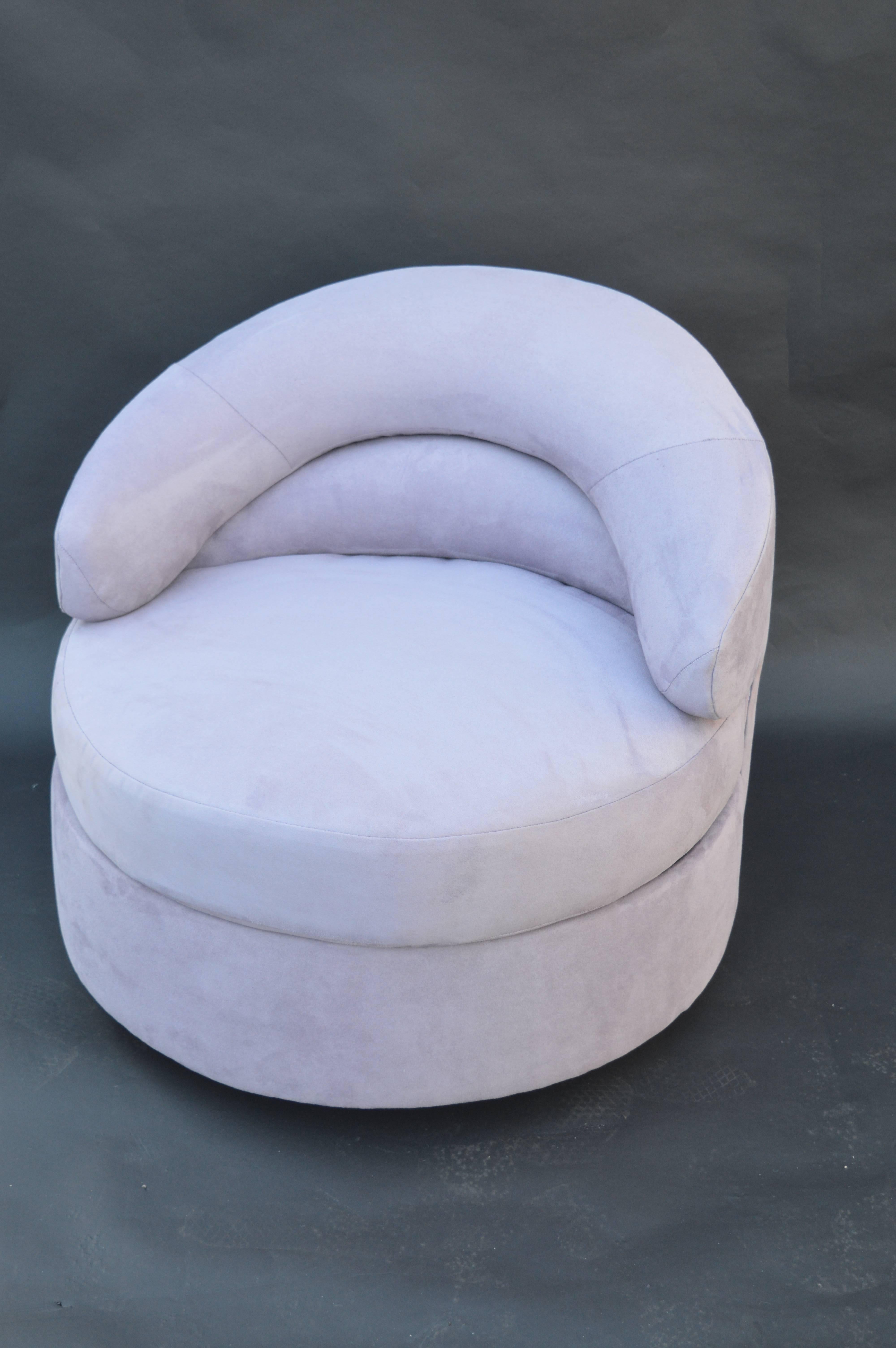 Pair of Directional swivel chairs. Newly upholstered in a light purple suede.