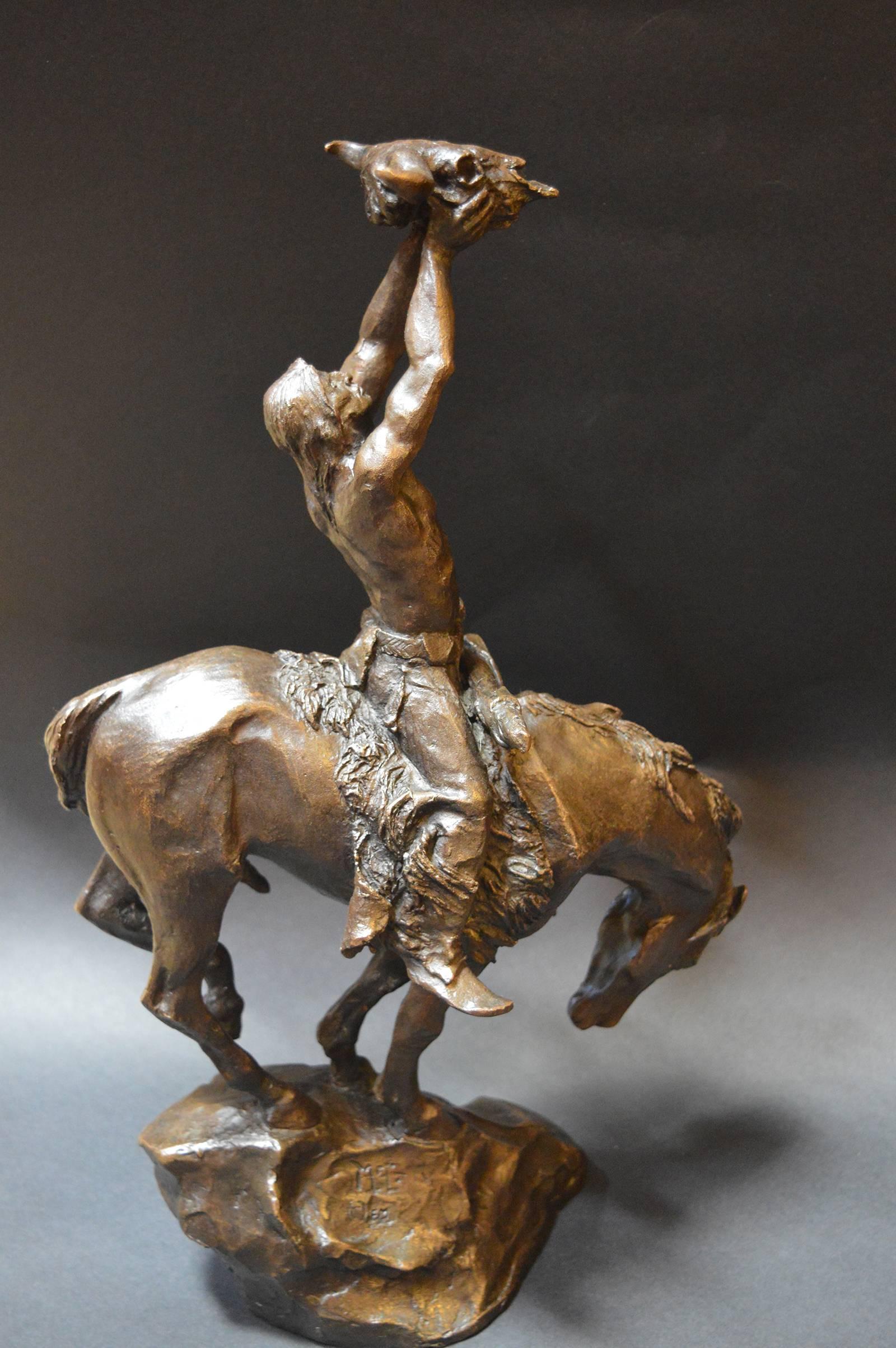 bronze indian on horse statue