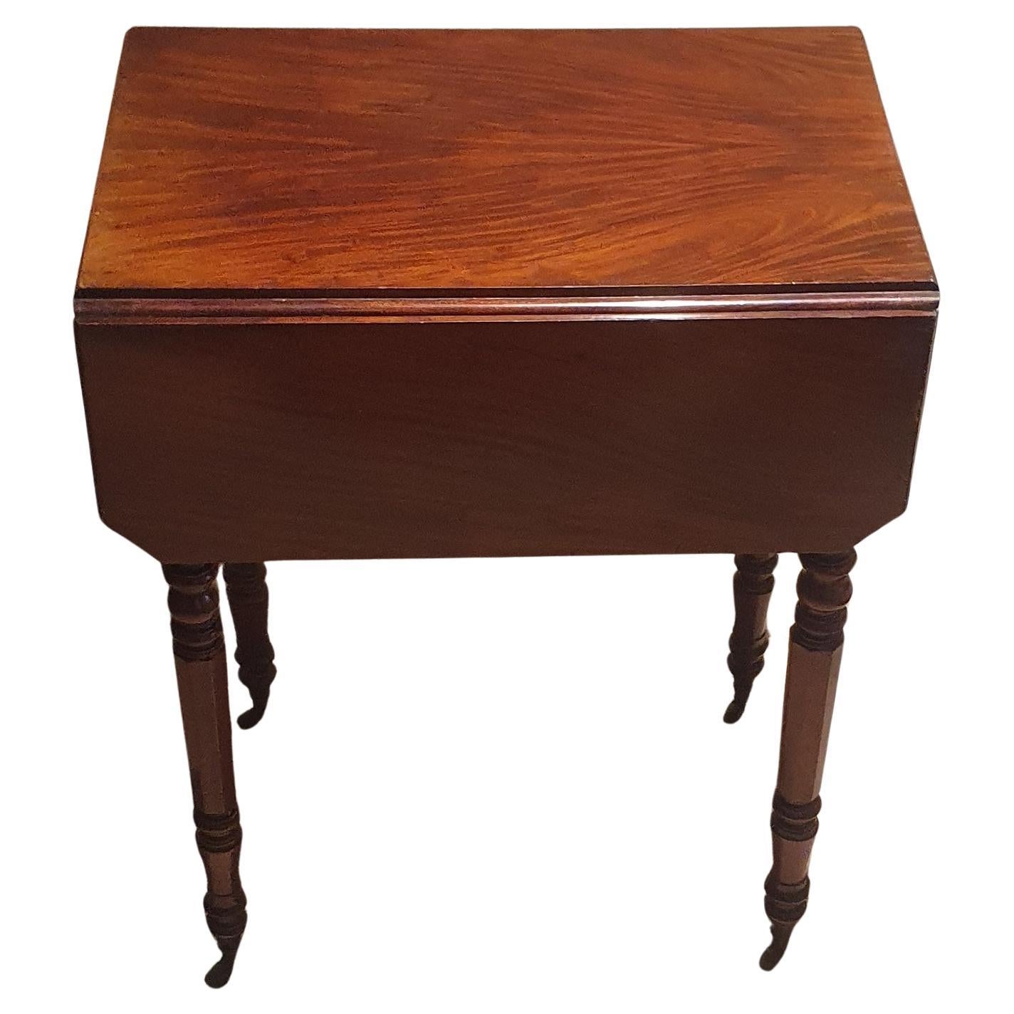 A William IV Mahogany drop leaf small side table with two drawers and side hatch
