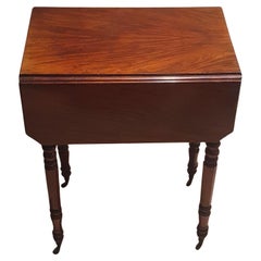 A William IV Mahogany drop leaf small side table with two drawers and side hatch