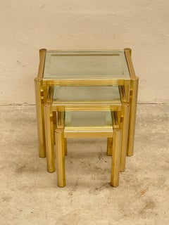Elegant set of 3 brass and glass coffee tables, "Golden Élite," 1970