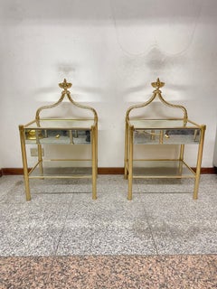 An elegant pair of nightstands in gilded brass and glass, “Royal Gold,” from the 1970s