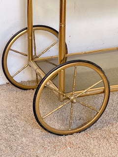 Brass bar cart with faux bamboo finish and glass, "L’Orfèvre," 1970s