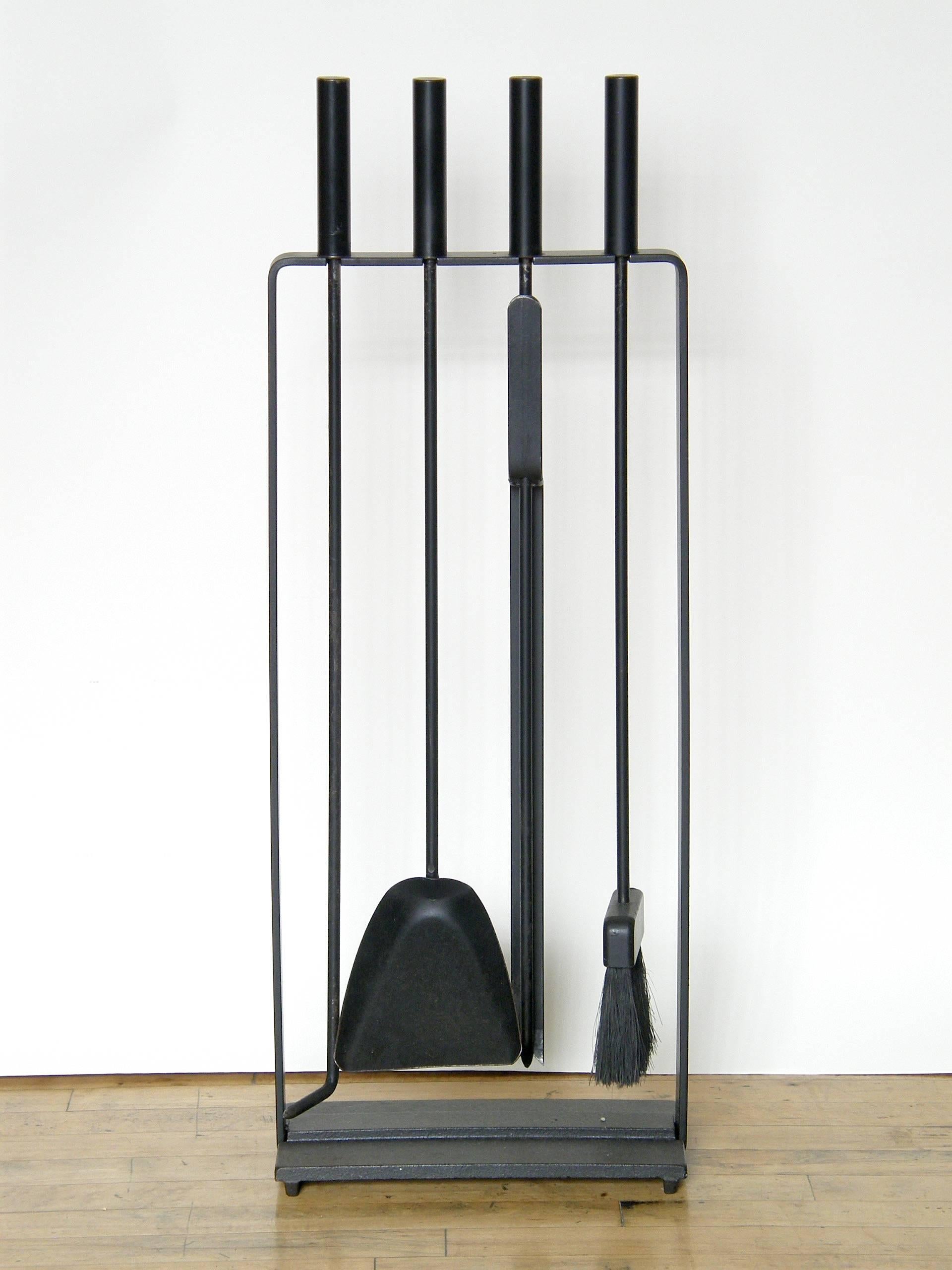 Modernist set of iron fire tools on stand by Pilgrim with poker, shovel, broom, and tongs style log grabber.

Please contact us if you have any questions.