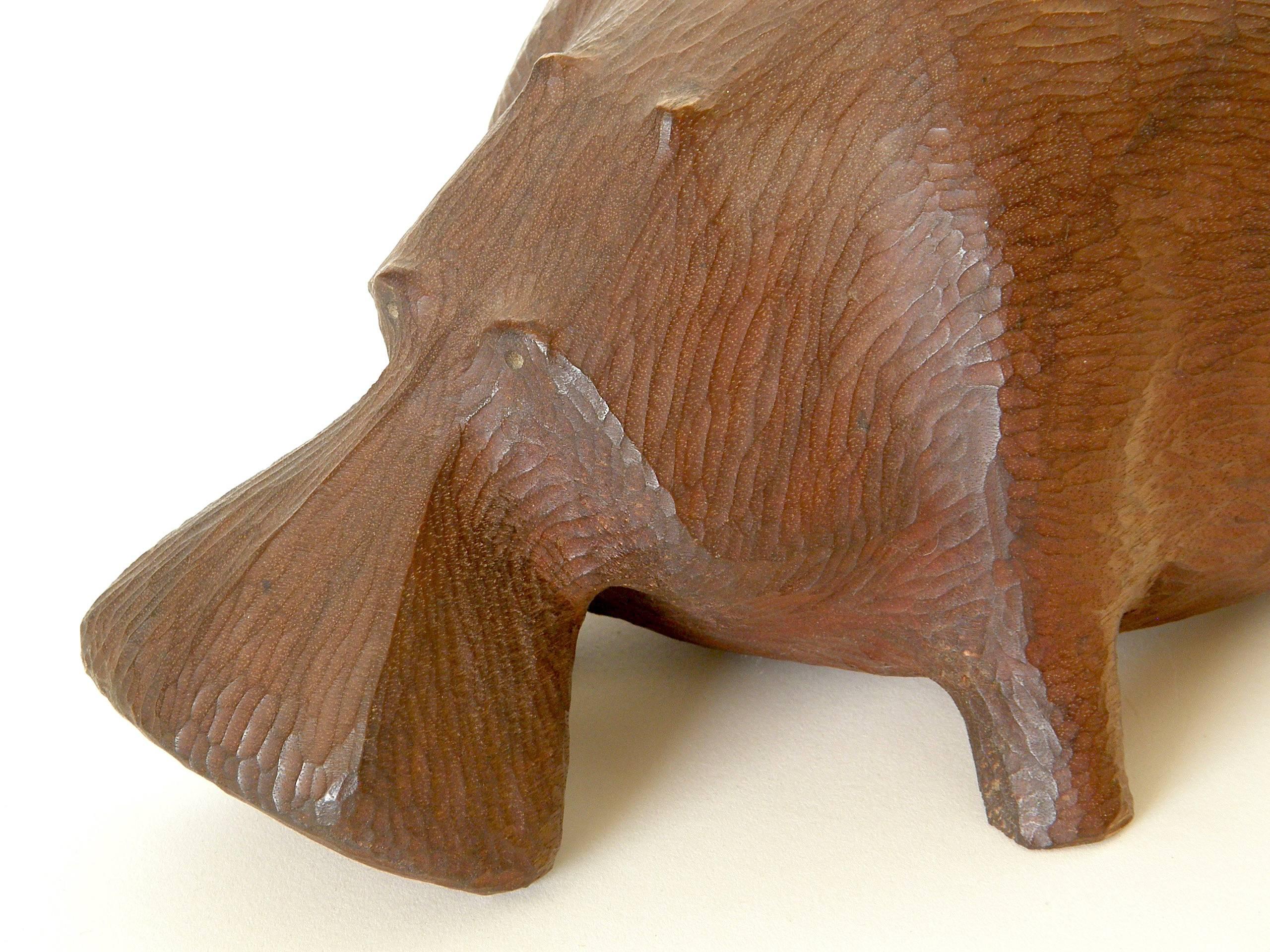 large carved wooden hippo