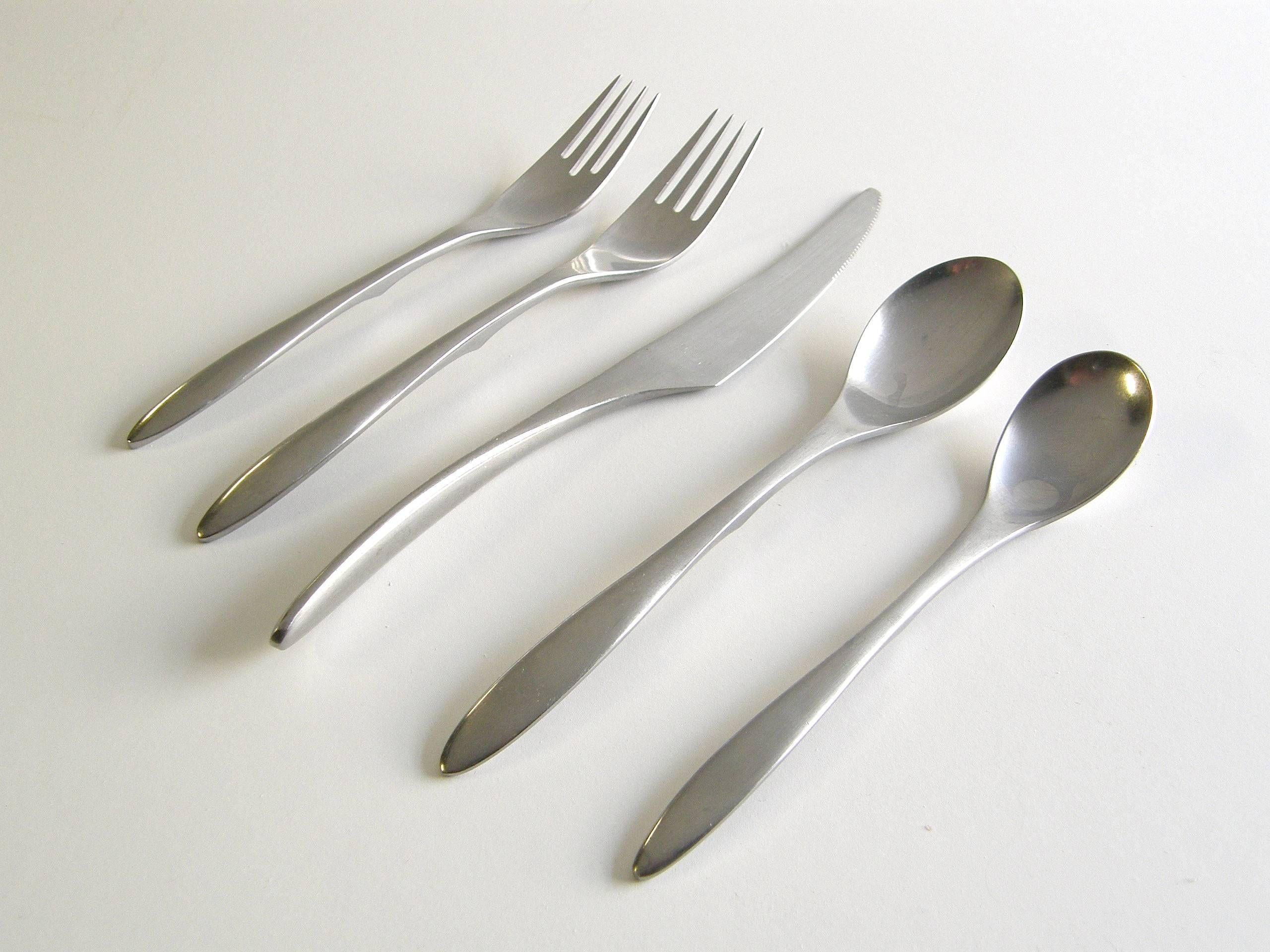 This sleek, modern flatware was designed for the PlayBoy club. Though not complete, it's hard to find large sets of this pattern.

7 salad forks 
9 dinner forks
16 dinner knives
19 tea spoons
13 table spoons
5 cold meat or seafood forks
1 master