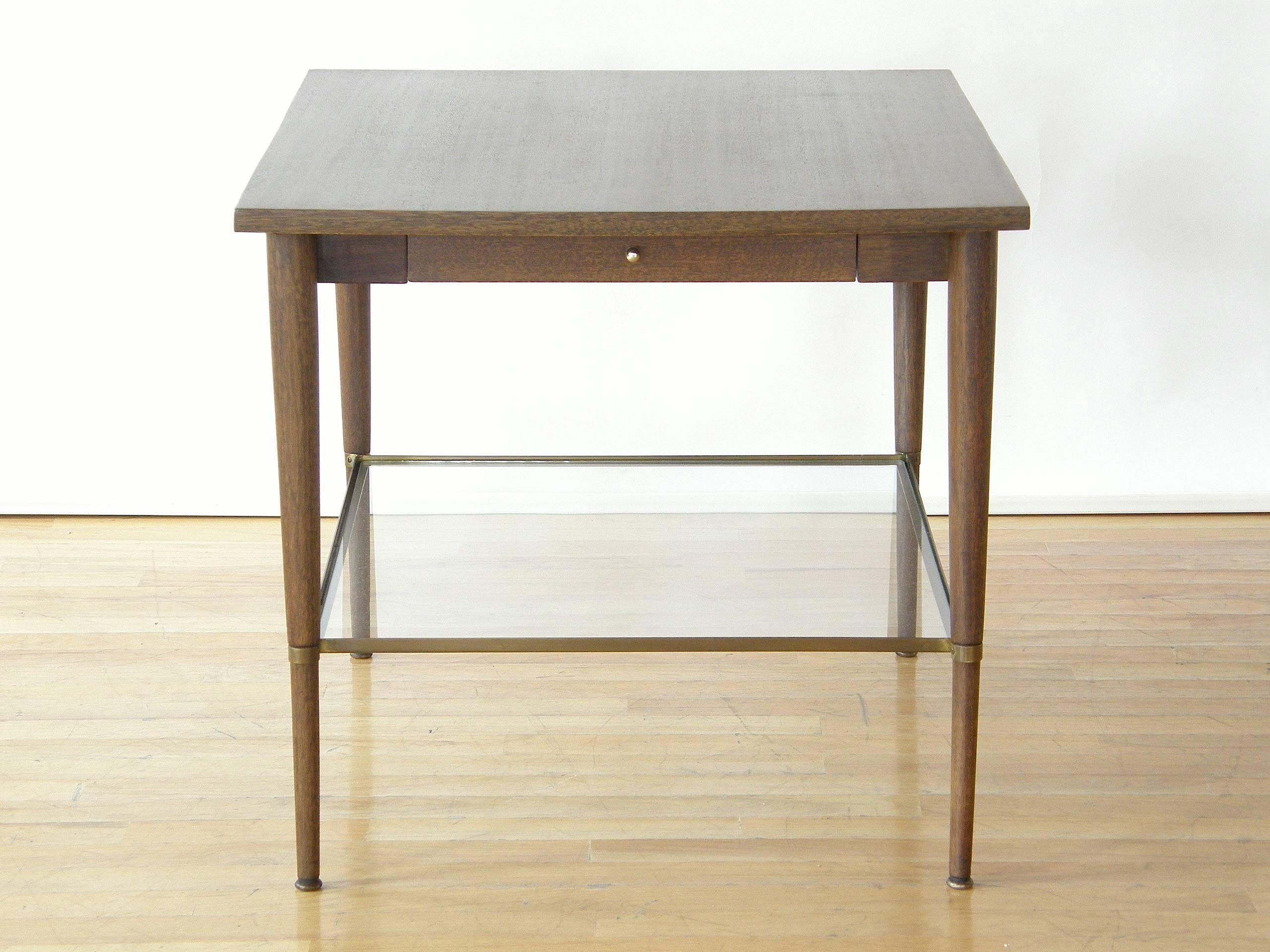 Side or end table with slender drawer and glass shelf designed by Paul McCobb. This piece is part of the Connoisseur Collection for H. Sacks and Sons.

Please contact us if you have any questions.