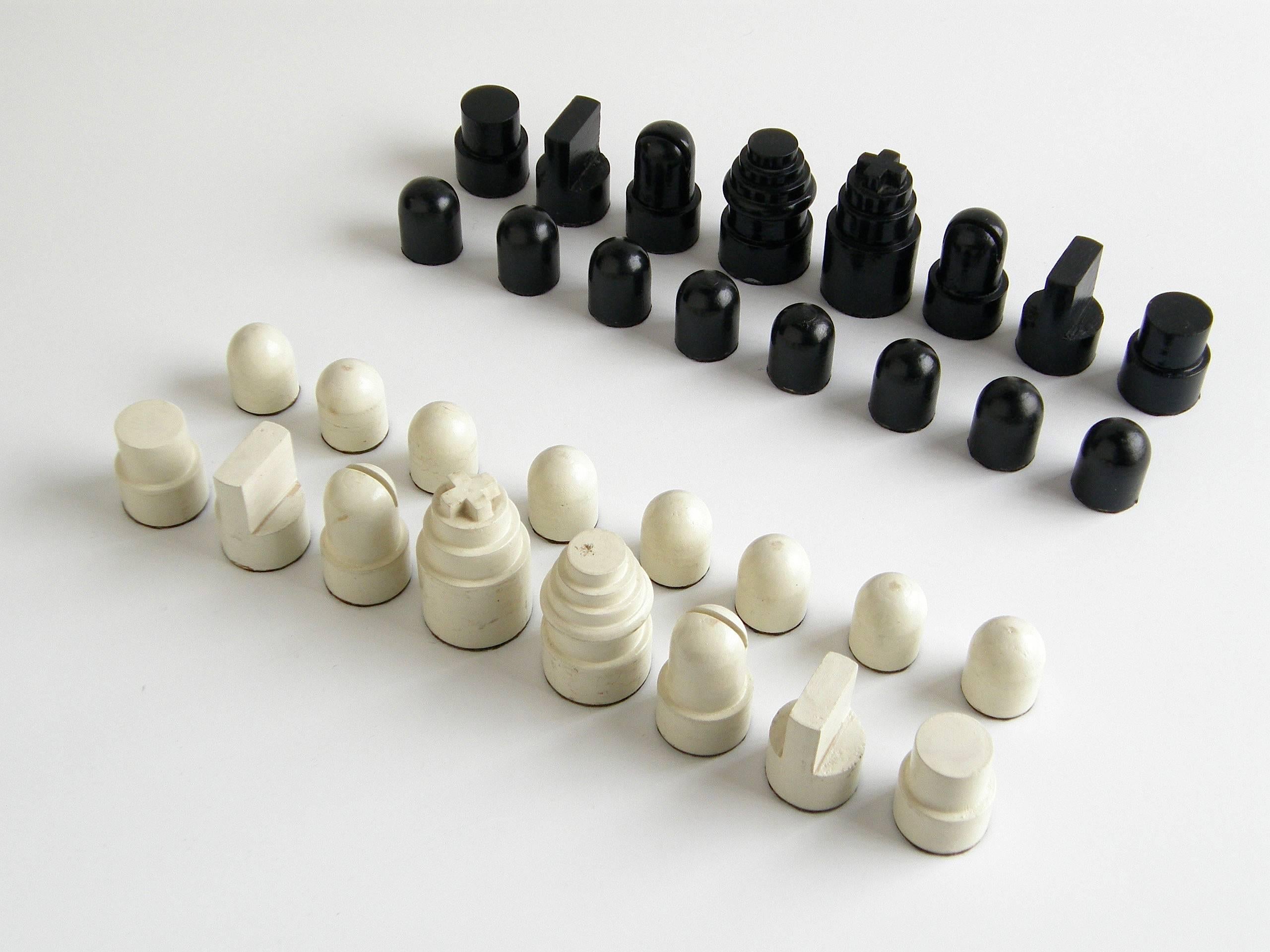 This painted wood chess set was designed and made by Allan B. Calhamer, the inventor of the highly influential strategy board game 