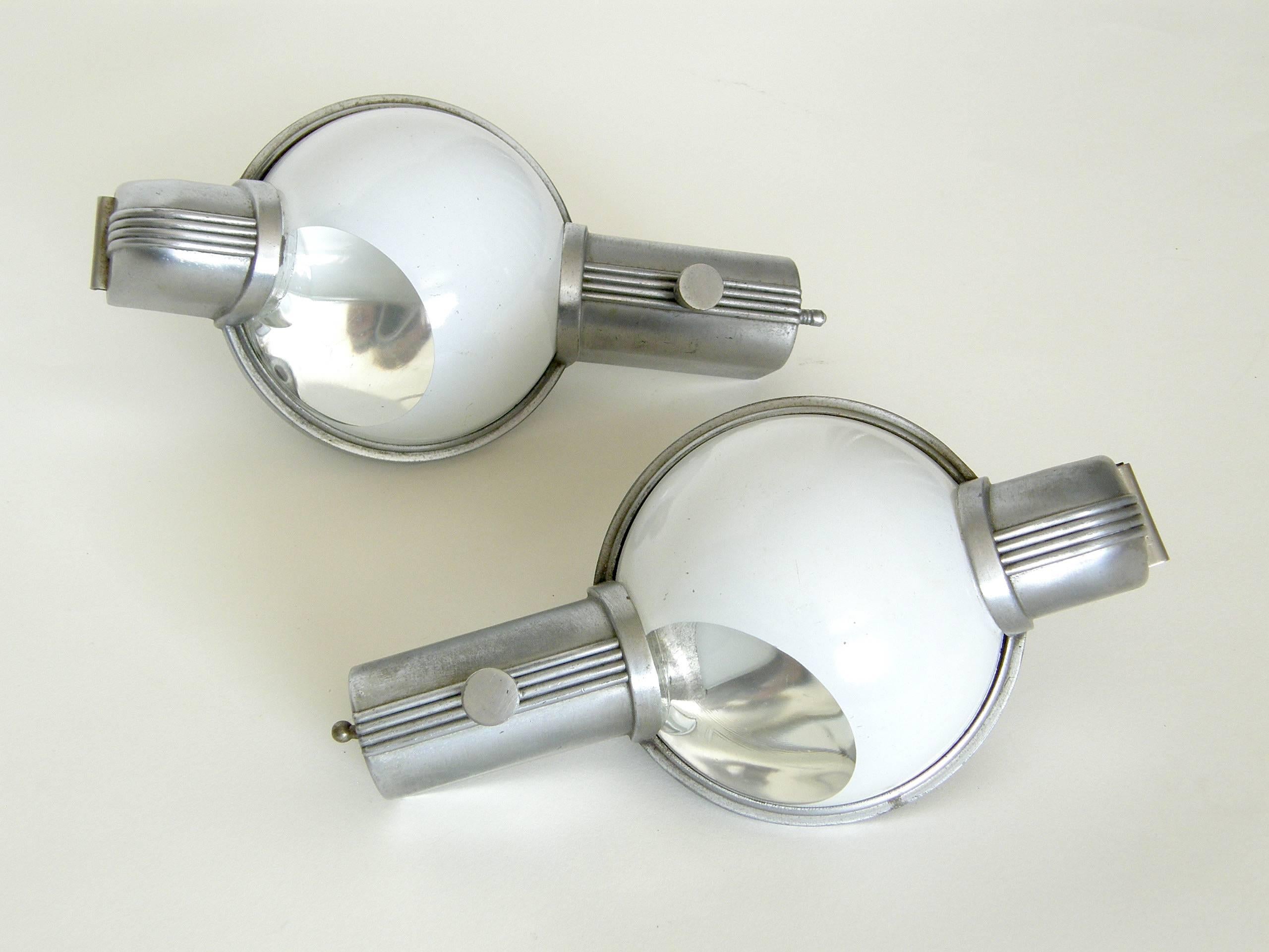 These streamlined, wall sconces were designed in 1938 by Henry Dreyfuss in conjunction with the Luminator Co. of Chicago. They were part of the original furnishings of the then newly redesigned, Art Deco style Pullman train cars of the 20th Century
