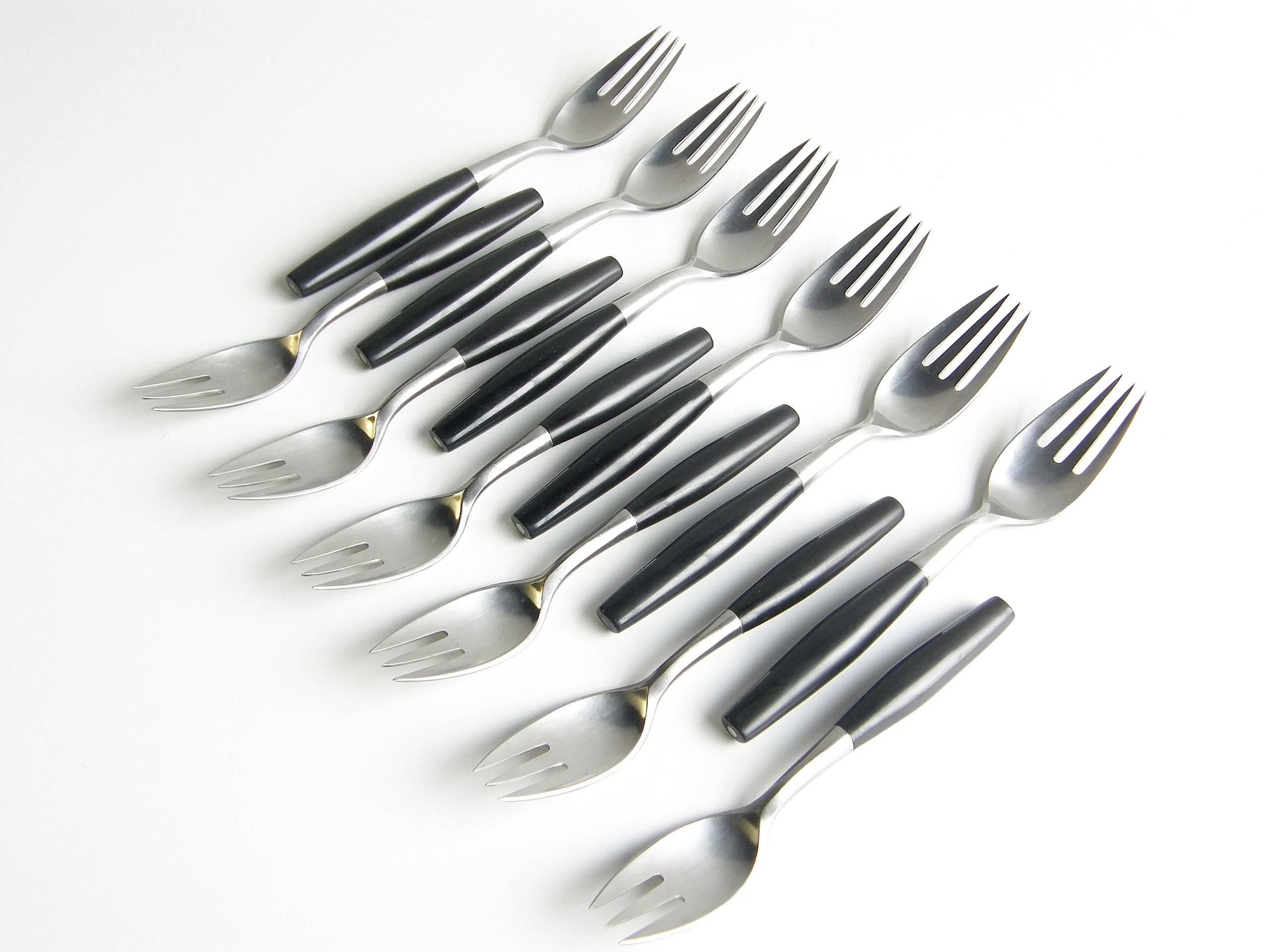 Service for six of "Kongo" flatware in stainless steel with nylon handles designed in 1954 by Jens Quistgaard for Dansk. This set is from an early production in Germany.

Six each salad fork, dinner fork, dinner knife, tea spoon, table