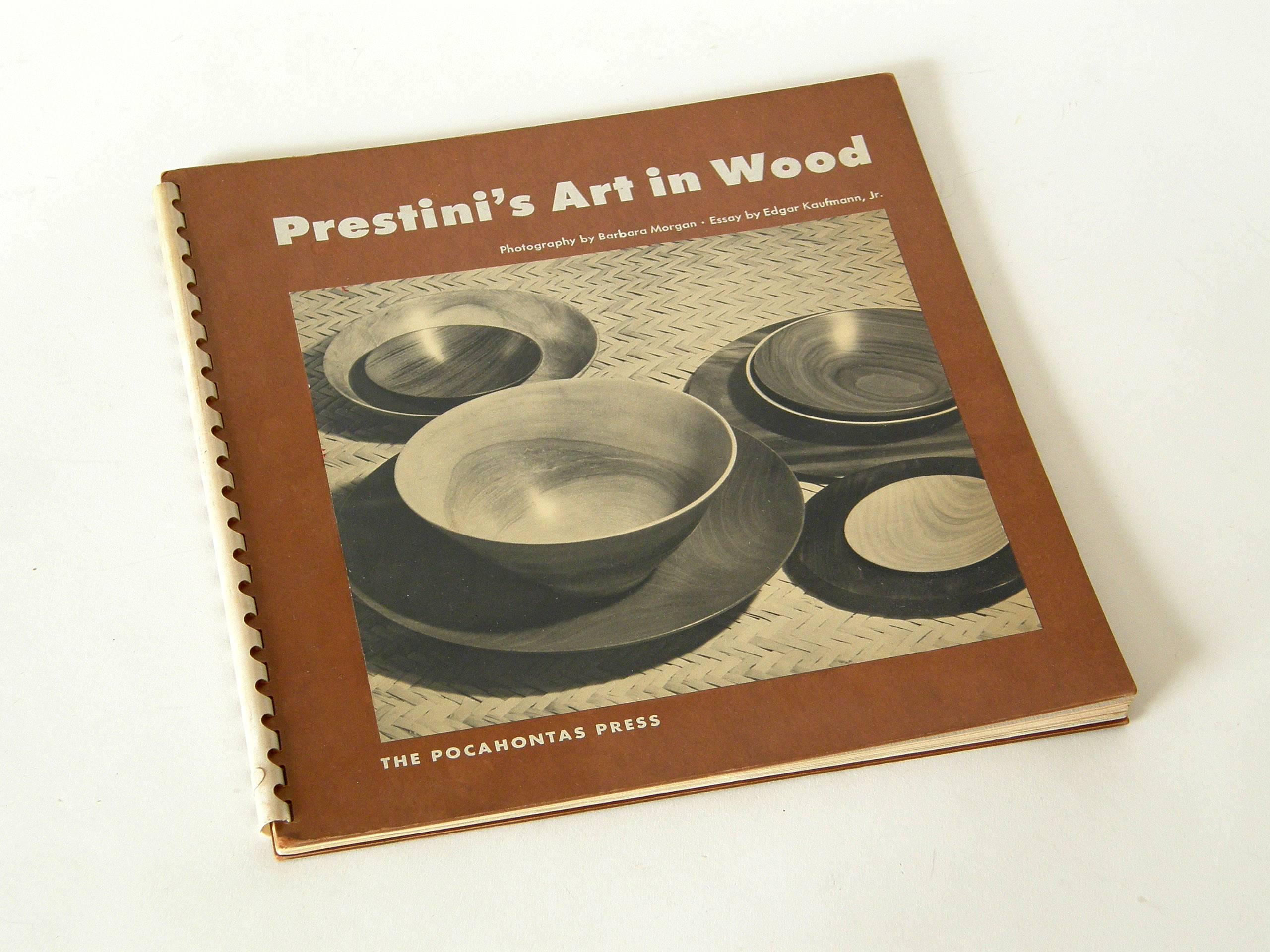 This monograph on James Prestini has an essay by Edgar Kaufmann Jr. and numerous, beautiful photographs by Barbara Morgan of Prestini's exquisite turned wood objects and experimental sculptures. The book is a first edition from a limited run of 1000