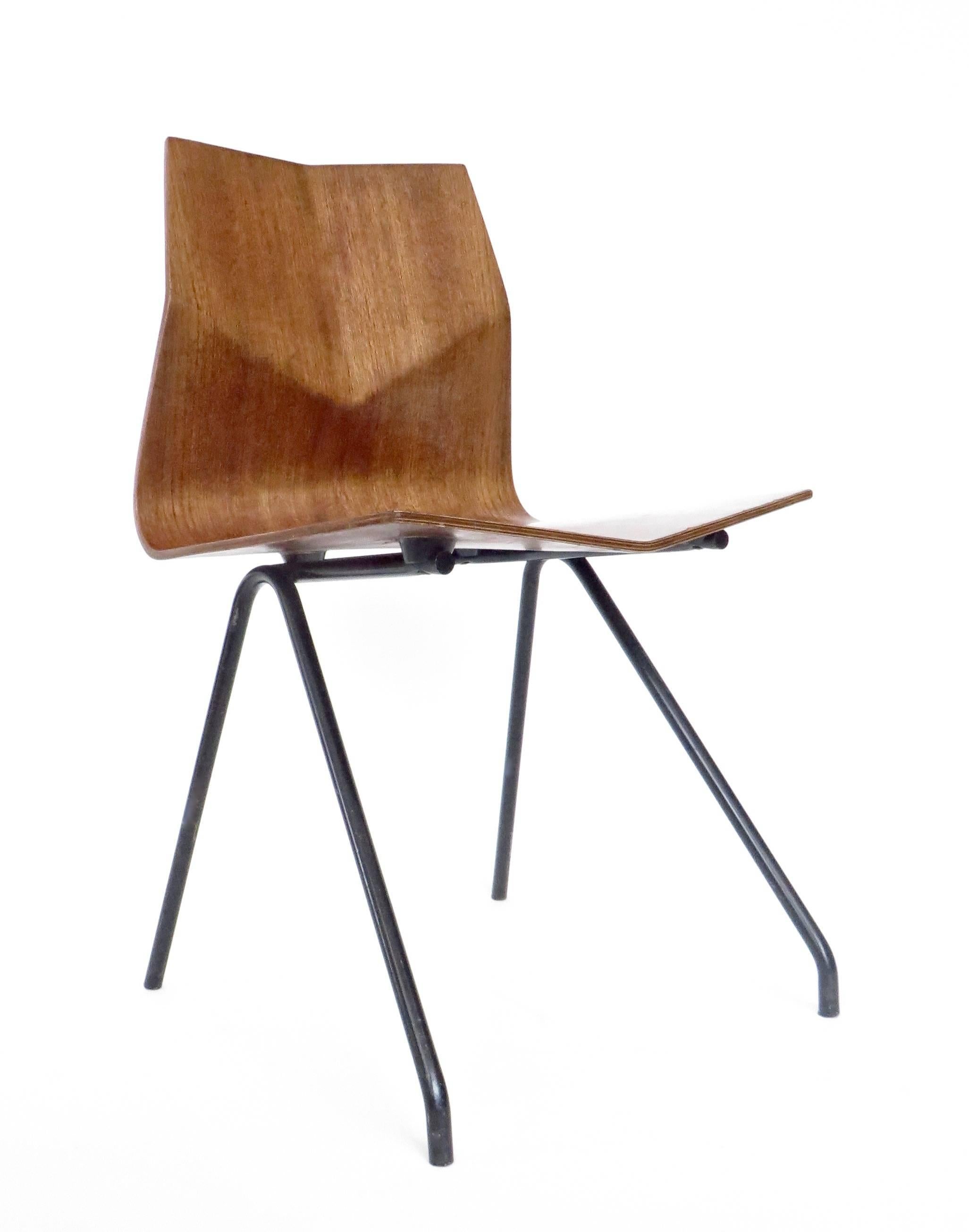 A single Rene Jean Caillette French circa 1958 Diamant diamond molded teak plywood with black metal legs desk or dining hair. 
A signature piece by Rene Jean Caillette. 
Edition Steiner.
Chair: 17.5