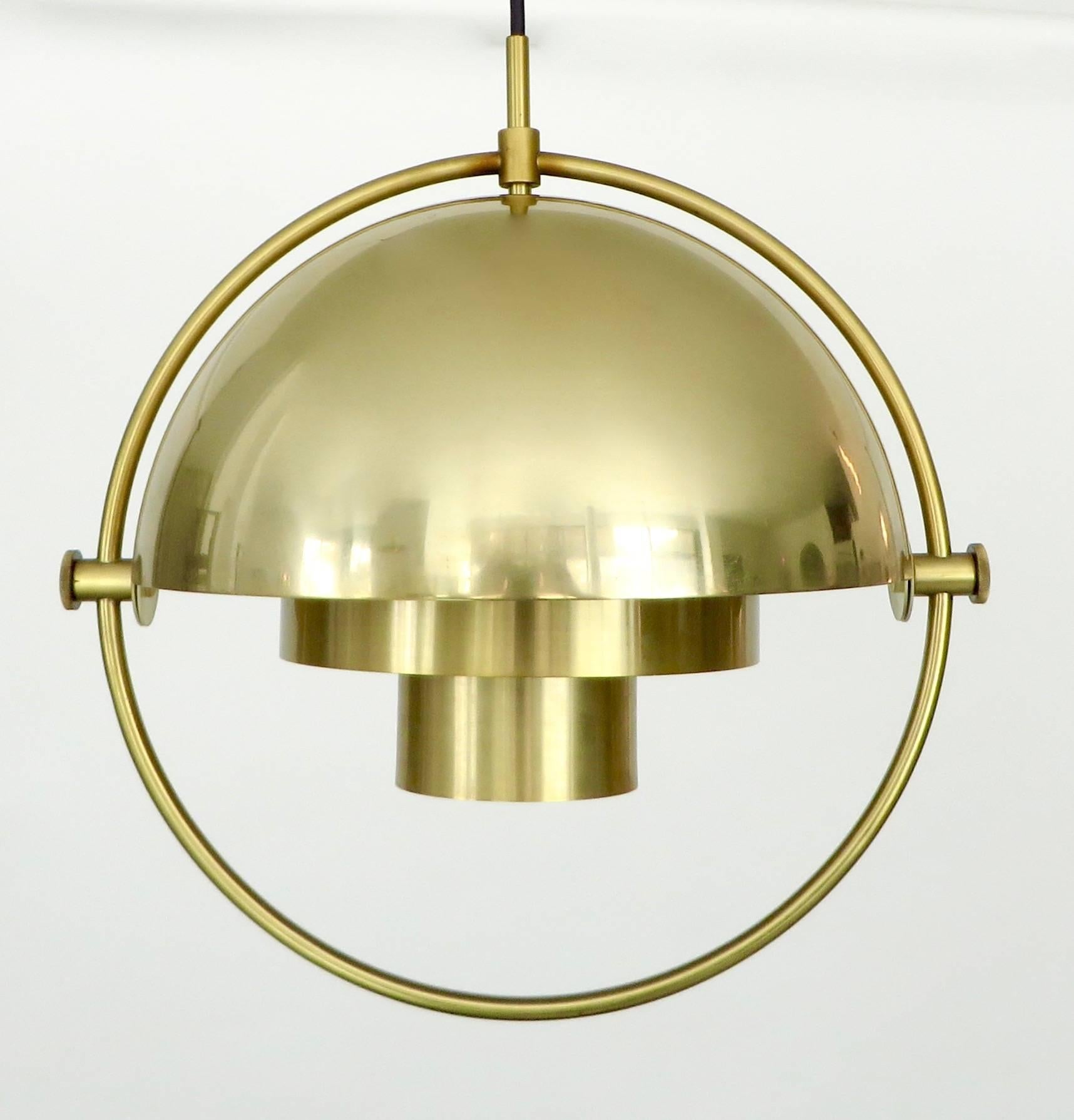 Brass vintage multi-lite pendant by Louis Weisdorf for Lyfa Denmark.
Rewired for USA. Single light source. Bulb up to 120 W.
The core of the multi-lite is a two-cylinder form that would work as a shade on its own but is additionally encompassed by