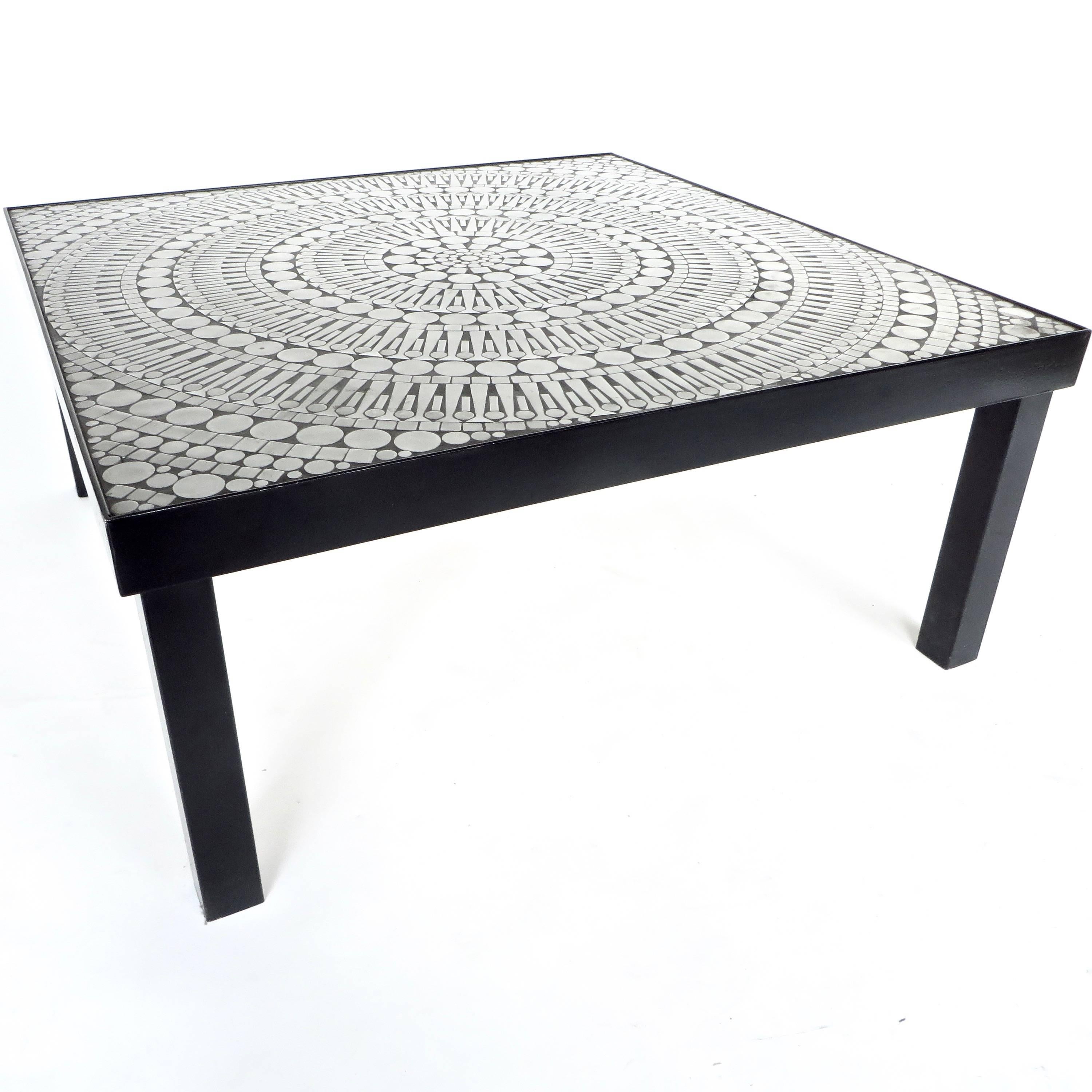 An aluminum inlaid mosaic coffee table by the Belgian designer artist 
Raf Verjans. 
The mosaic is set in a black resin and framed black enabled steel base. 
Excellent condition, no missing or loose mosaic pieces, 
circa 1970.