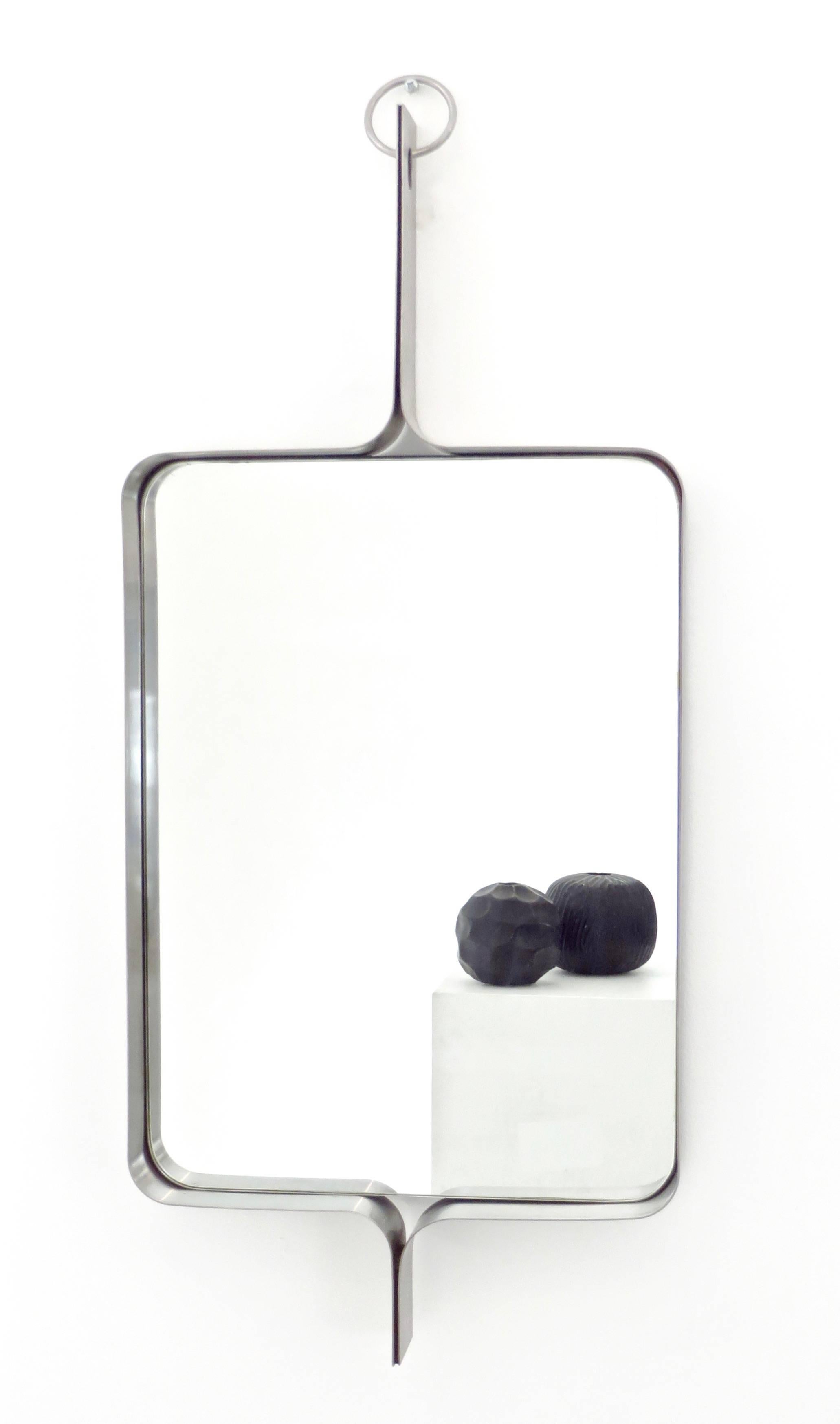French stainless steel rectangular mirror by Michel Boyer (1935- 2011).
Boyer was a designer and decorator. 
He opened and exhibited at the Galerie Rouve, rue Bonaparte in Paris from 1968. 
One of his most famous interiors was the interiors of