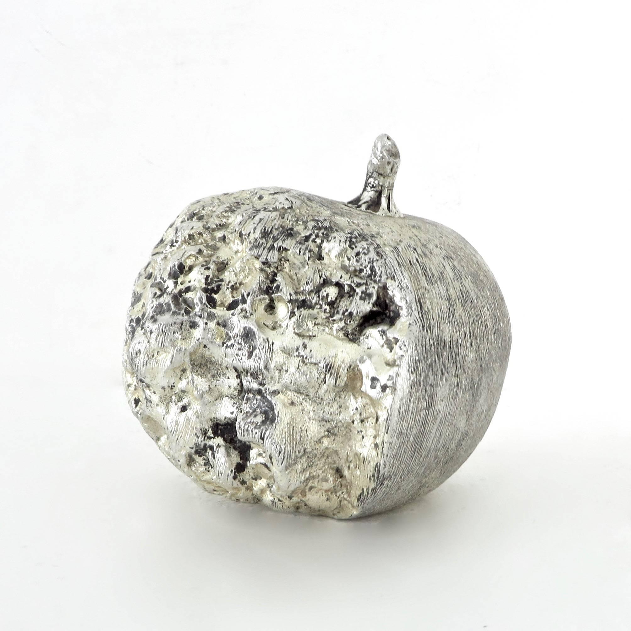 A small lifesize silver leafed bronze sculpture of a pomegranate. 
Finely detailed. 
Signed E.B.