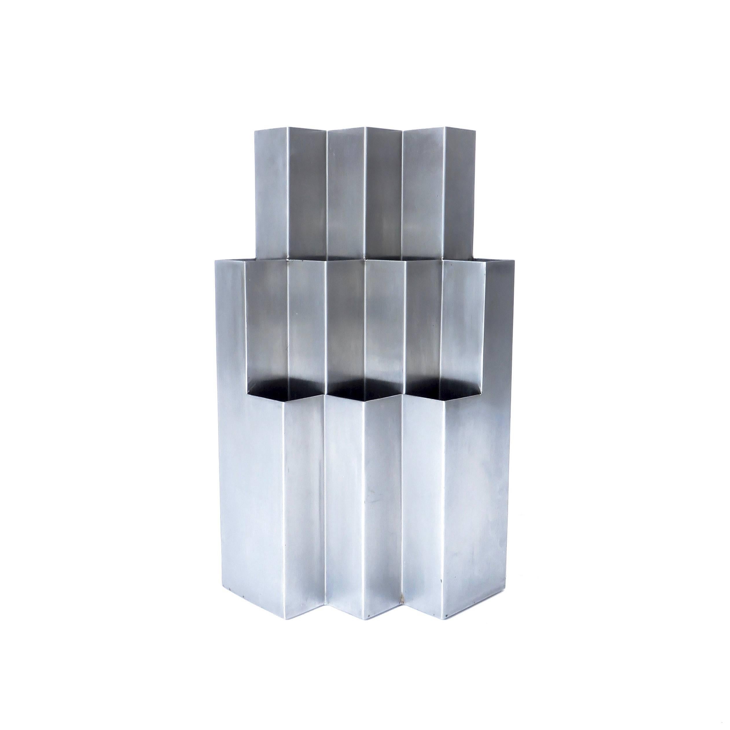 A French, circa 1970s stainless steel jardinière or umbrella holder that is more sculpture than function.
Attributed to Francois Monnet, France, circa 1970.
In the school of Pergay, Monnet, Boyer, Kappa Editors.