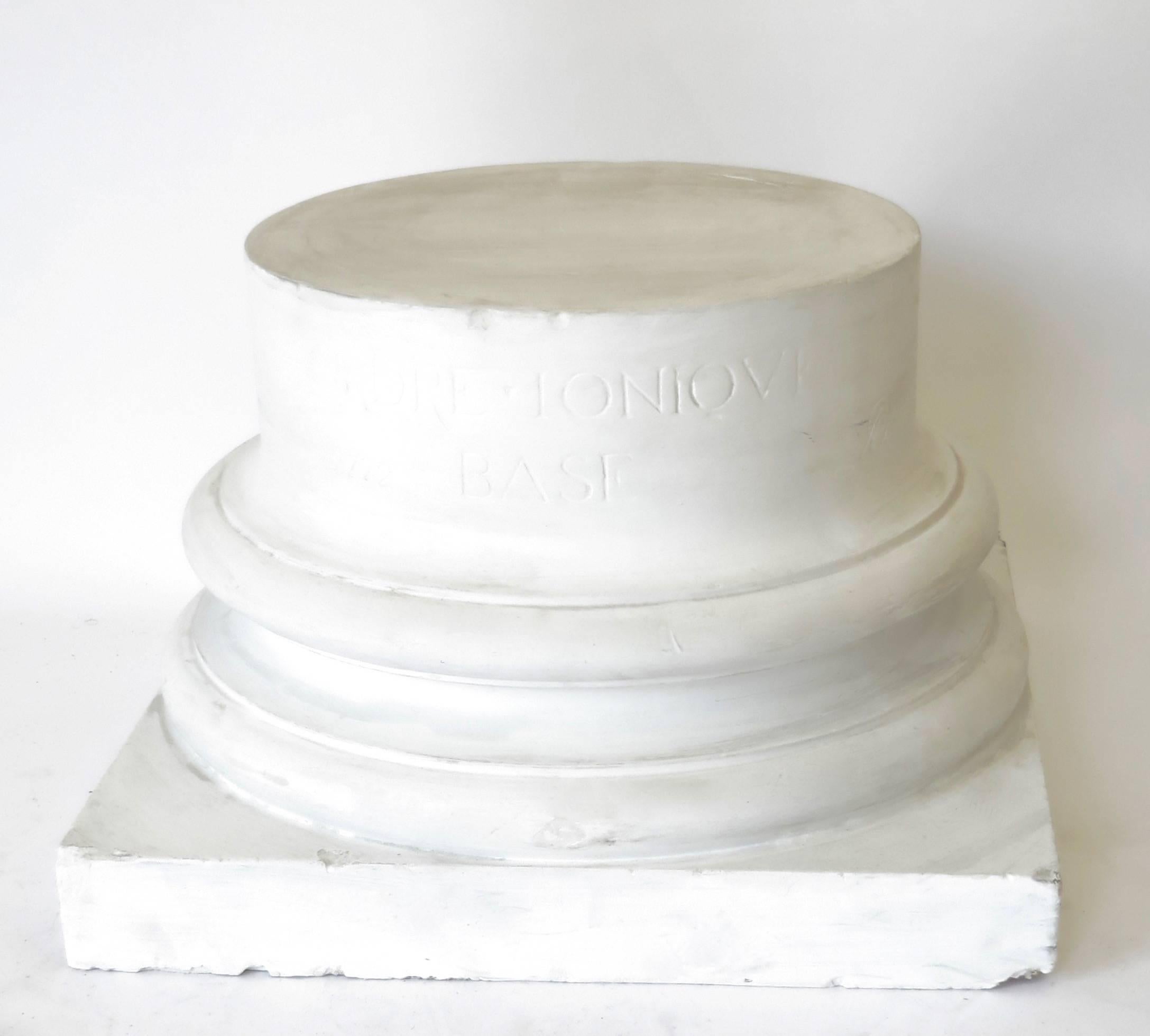 A vintage late 19th century French white plaster ionic column base used for architectural drawings classes. 
Signed, stamped and marked. 
The diameter of the top surface is 16