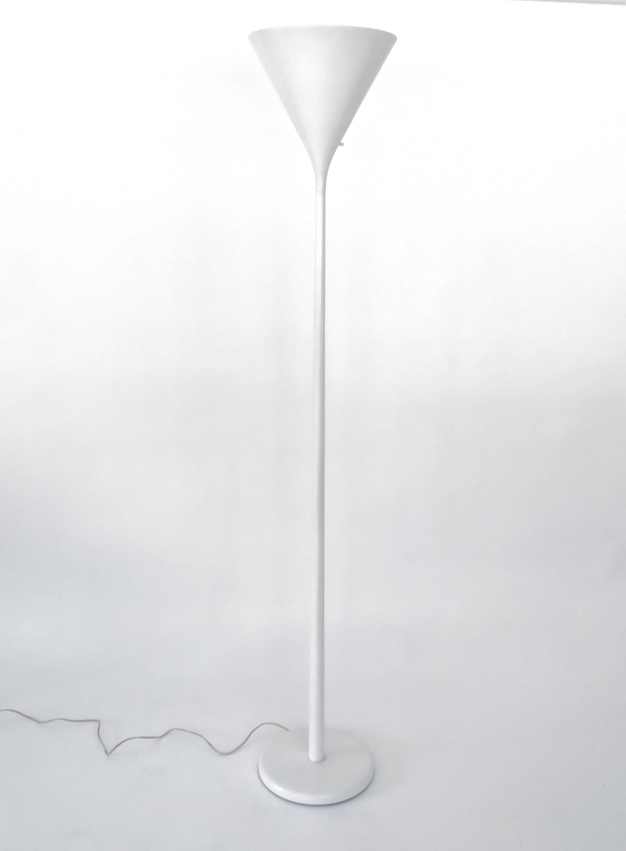 A Walter Von Nessen lacquered white aluminum torchiere floor lamp stamped Nessen Studio on the base.
An elegant minimalist floor lamp for modernist interiors. 
No longer in production circa 1975.
Three-way on-off switch. 40,60 75 W bulb. 