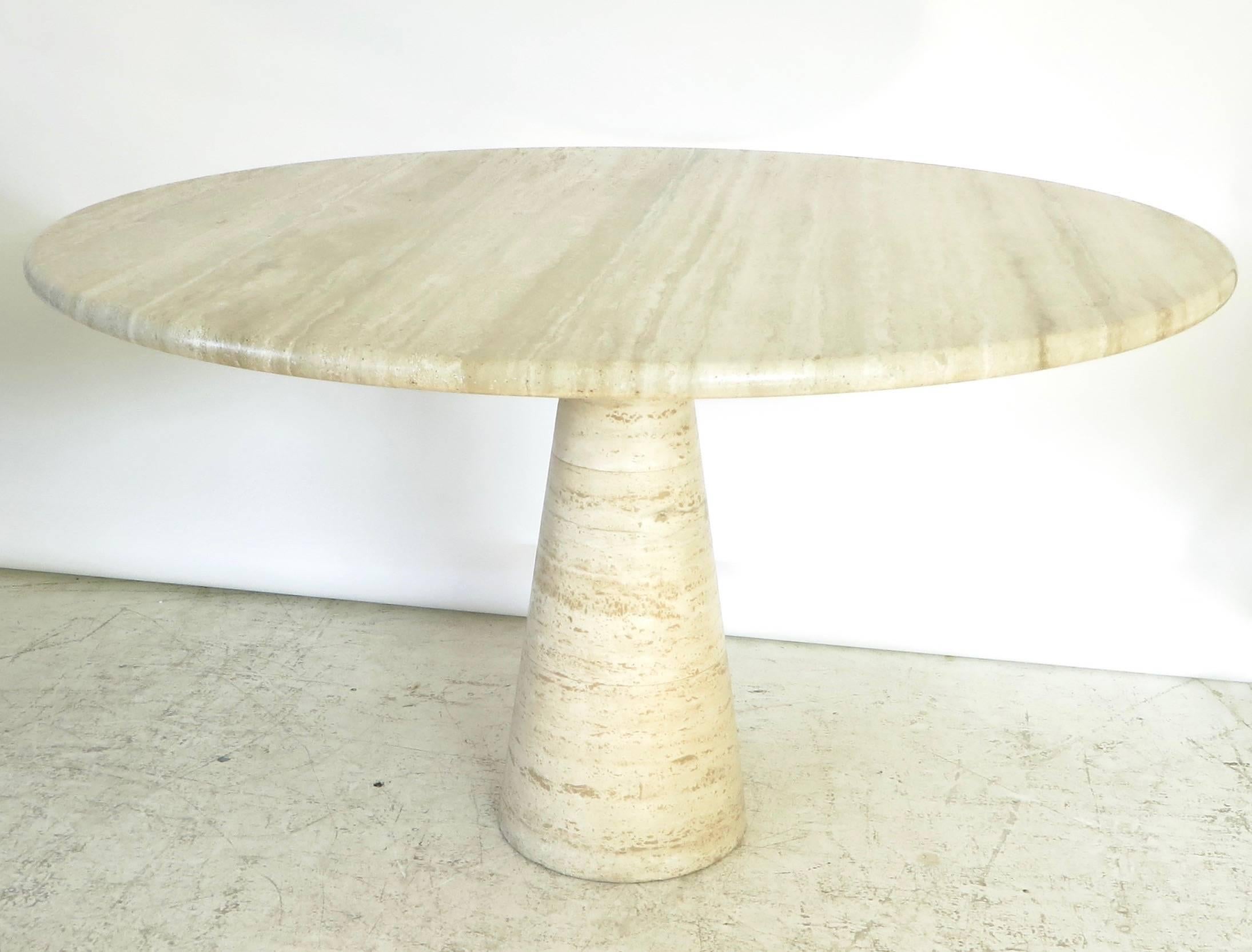 Italian travertine dining or center table attributed to Angelo Mangiarotti.
Variegated tones of cream, beige, pale brown and touches of gray travertine marble,
Italy, circa 1970.
Please note that we have two tables, they are very very similar but as