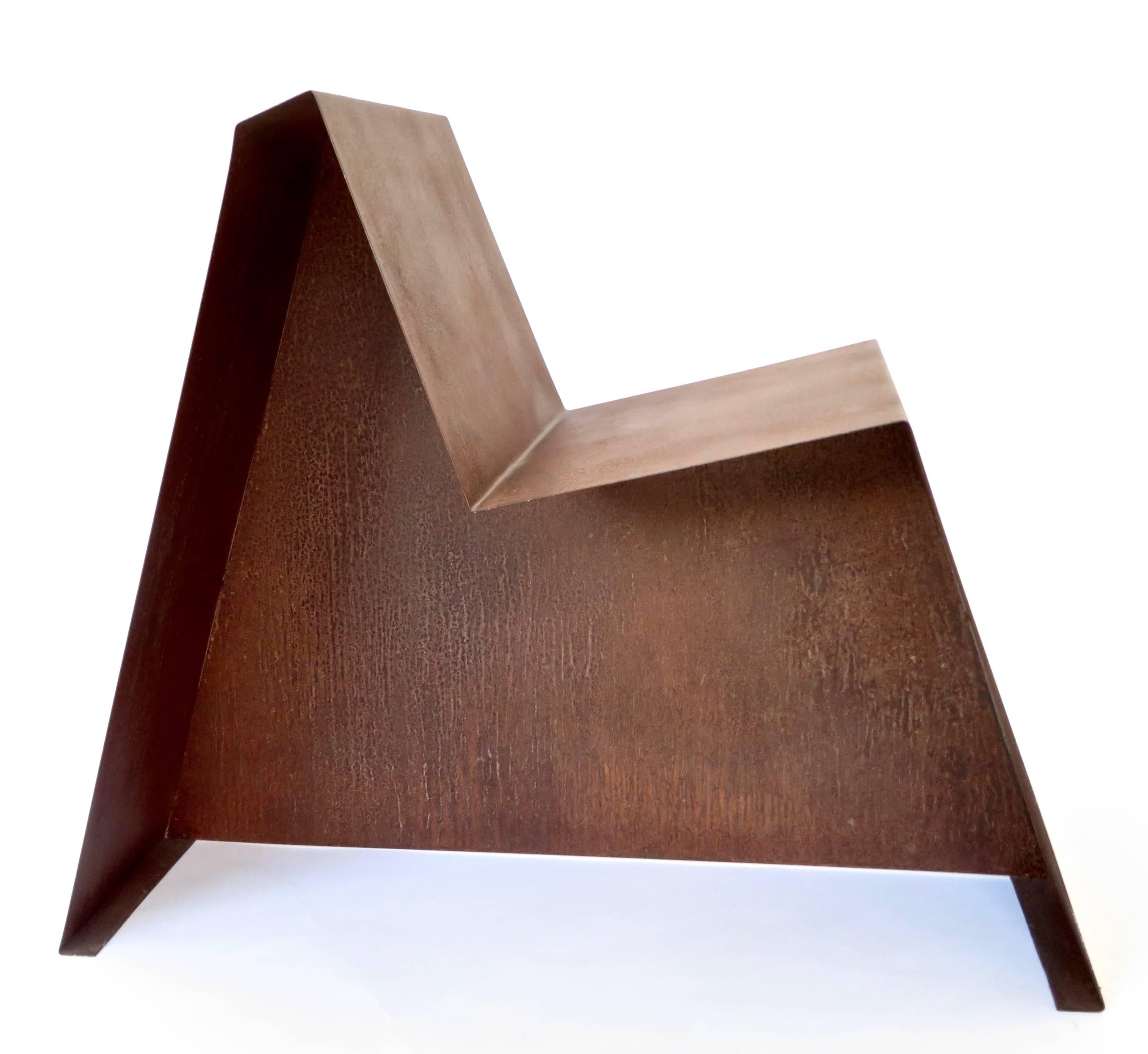 Folded sheet metal rusted steel sculptural chair by Hannah Vaughan. 
Hannah Vaughan was born in Los Angeles, CA to a bookbinder and an artist. Hannah attended Oberlin College in Ohio where she majored in fine art and religion. She continued her