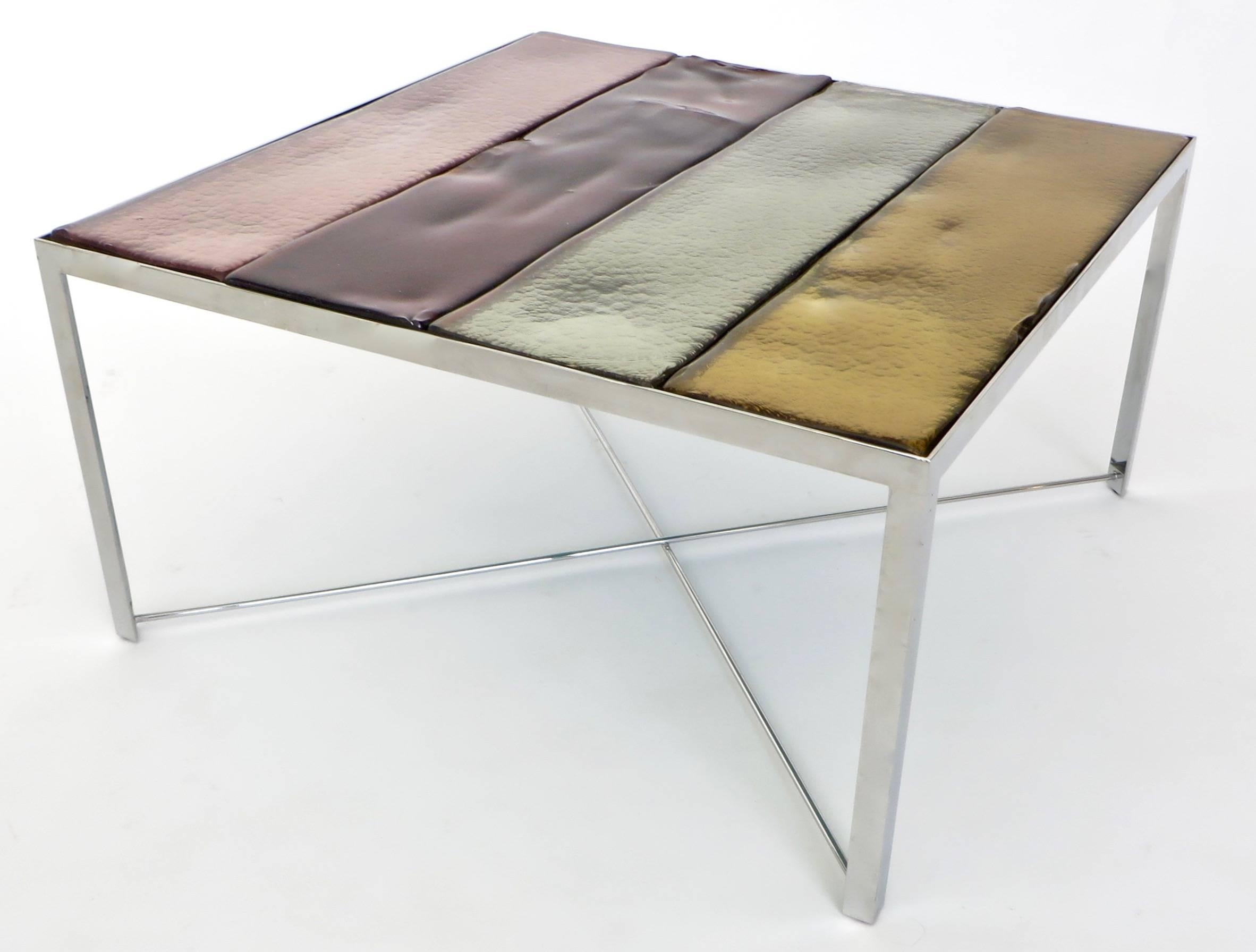 Mingus side or coffee table by Rudolfo Dordorni for Venini & Co, Murano Italy, 2000. 
This table was part Venini's debut Quintet Furniture collection. 
Chrome-plated steel with cast glass panels in four beautiful vanini colors.
Undulating subtle