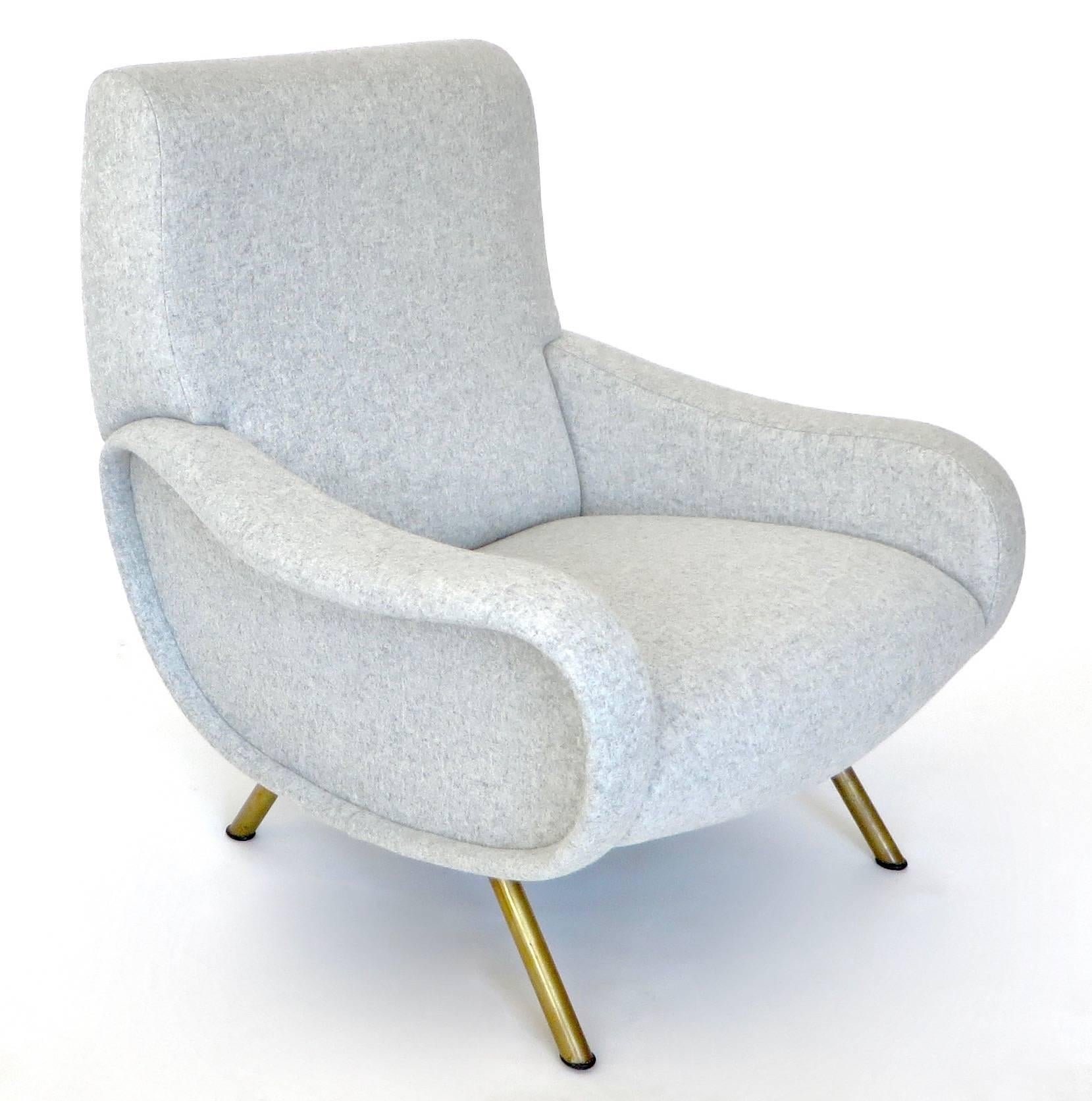 The lady chair was designed by Marco Zanuso for Arflex in 1951.
It won the award Medaglia d’oro or Gold Medal at the Milan IX Triennale in 1951. 
Newly restored and reupholstered in Maraham Davina light gray wool, original brass legs.
Overall