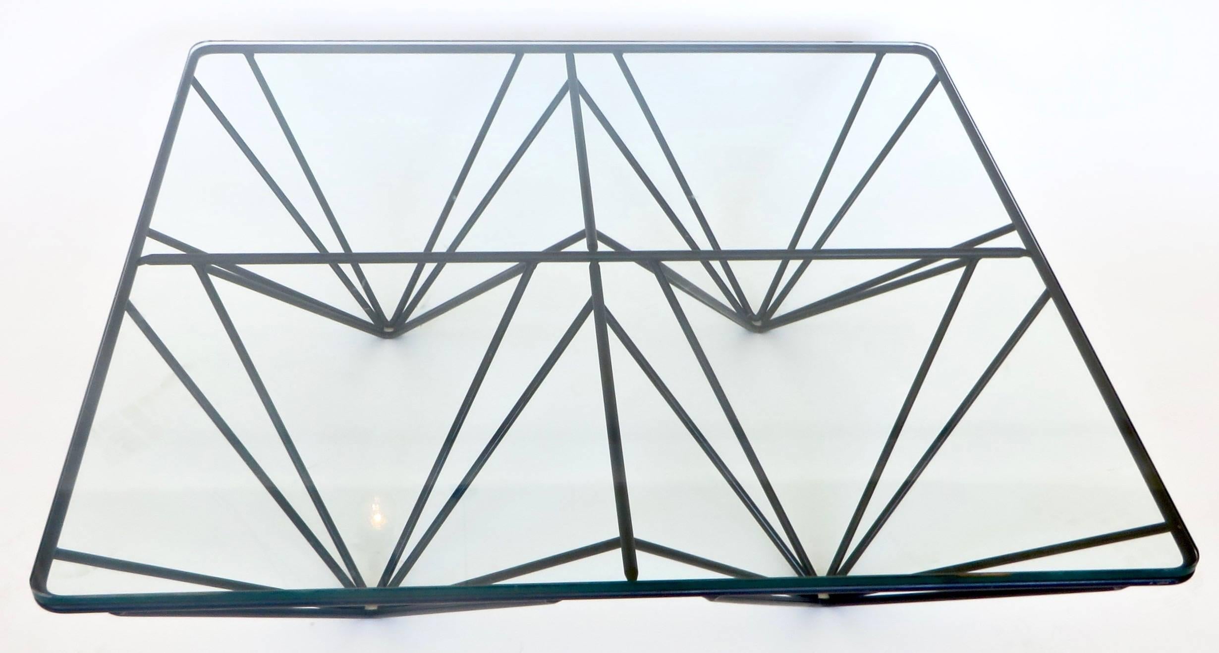 A low square black steel and glass plateau coffee table in the style of the Alanda table by Paolo Piva for B&B Italia.
The graphic nature of the table makes it a very strong statement.
The glass has been replaced as the old glass was very