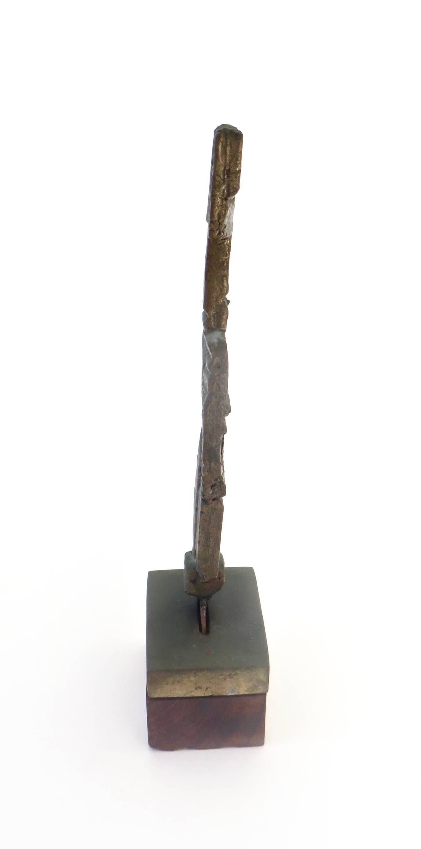 A cast bronze, abstract sculpture by the artist known as Fitzia. 
Fitzia Mendialdua Chopin was born in France in 1931 and relocated to Mexico in 1951. Fitzia is mostly known for her abstract paintings and collages. 
This small bronze TOTEM like