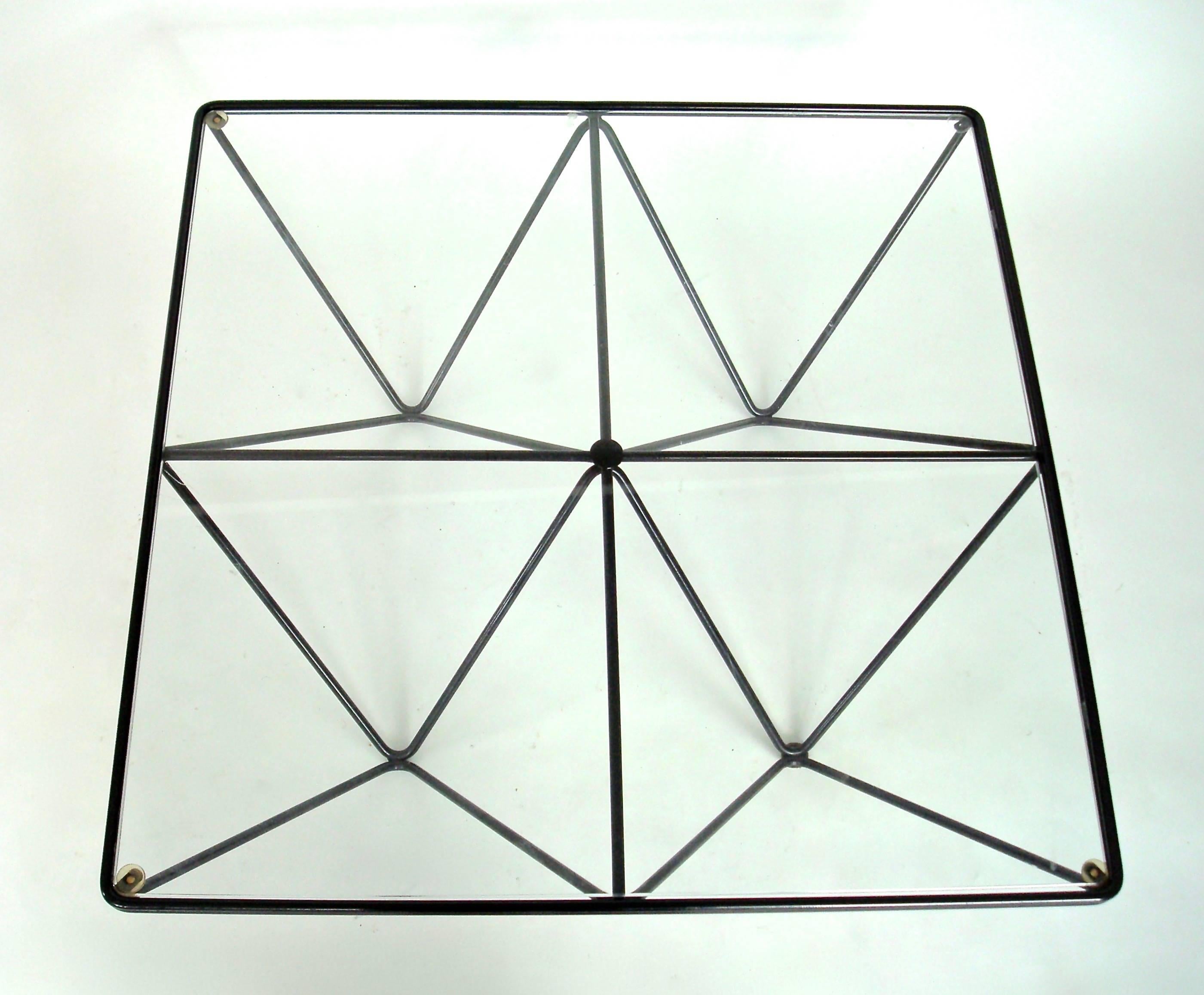 Alanda table attributed to Paolo Piva and was editioned by B&B Italia, circa 1980.
Welded enameled double steel rods with a glass top. Very graphic table with black steel rods and clear glass top. 
Several sizes were designed and produced, no longer