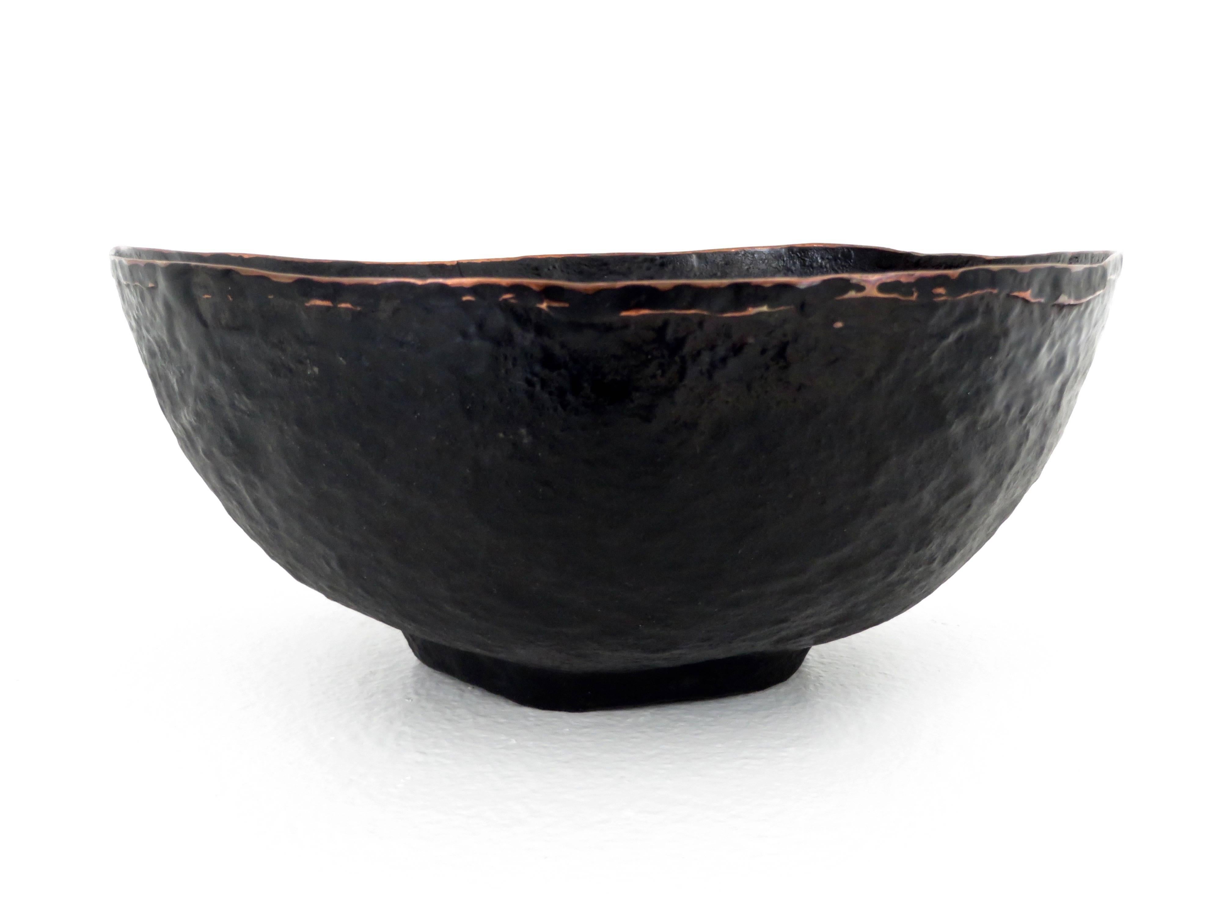 A deep footed hand-hammered copper sculptural and highly textured bowl by HVNTER GVTHERER in the Poros series.
The meditative process of hand hammering each piece results in each piece being unique.
The highly textured surface is created by a