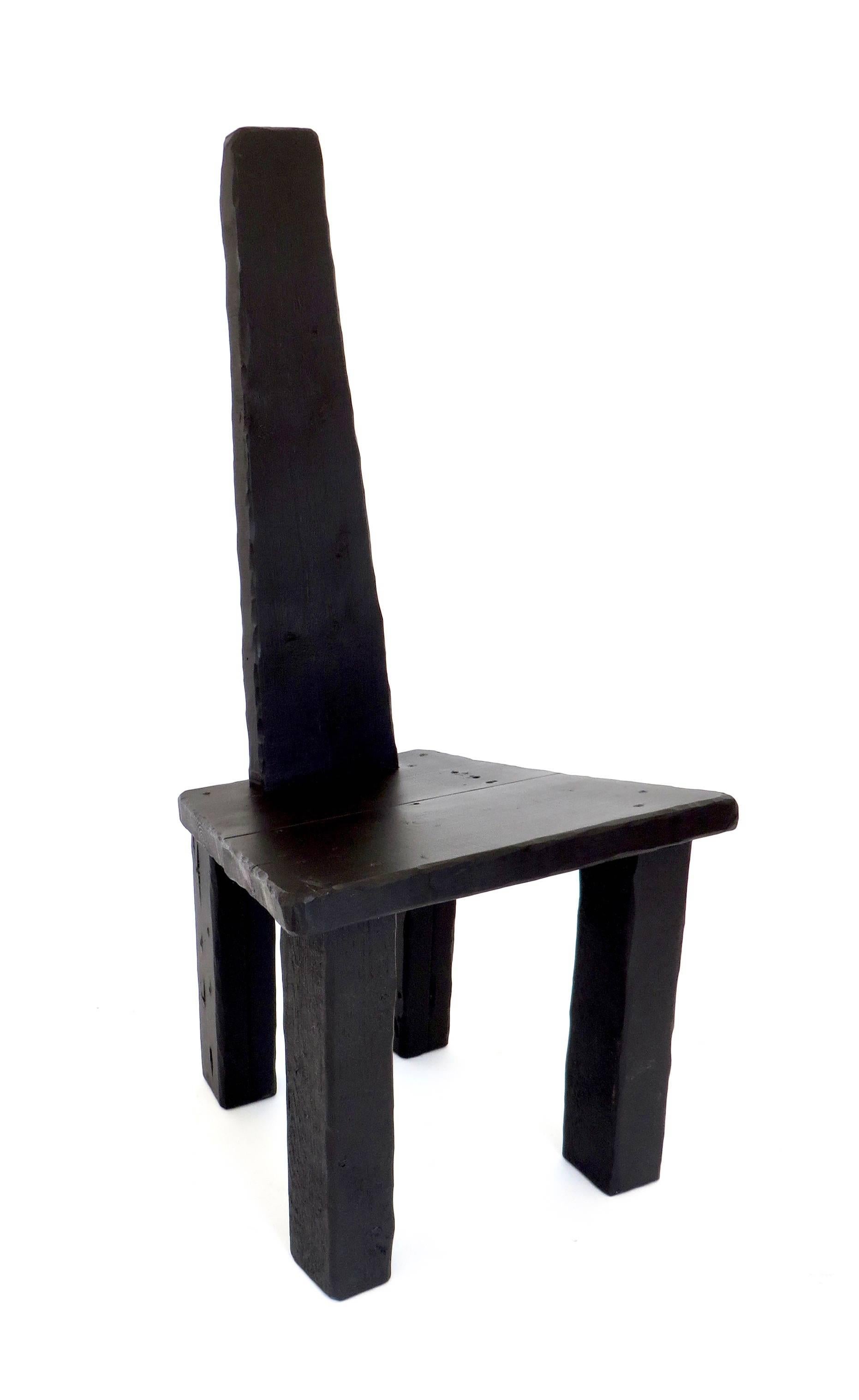 A hand-carved salvaged recovered contemporary wood chair made by artist designer Hannah Vaughan.
This chair is part of the 2017 anthropological collection limited edition series.
#1 of 10.
Black artists acrylic paint sealed with beeswax. All