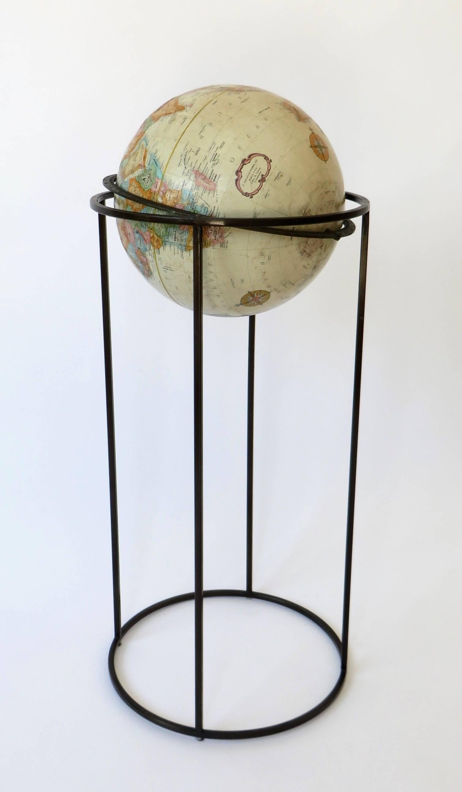 This Replogle 12" "World Classic" series standing globe, circa 1970 and is attributed to Paul McCobb. The rotating globe is in excellent condition. The base is in excellent condition.
The three pole base is circular and very